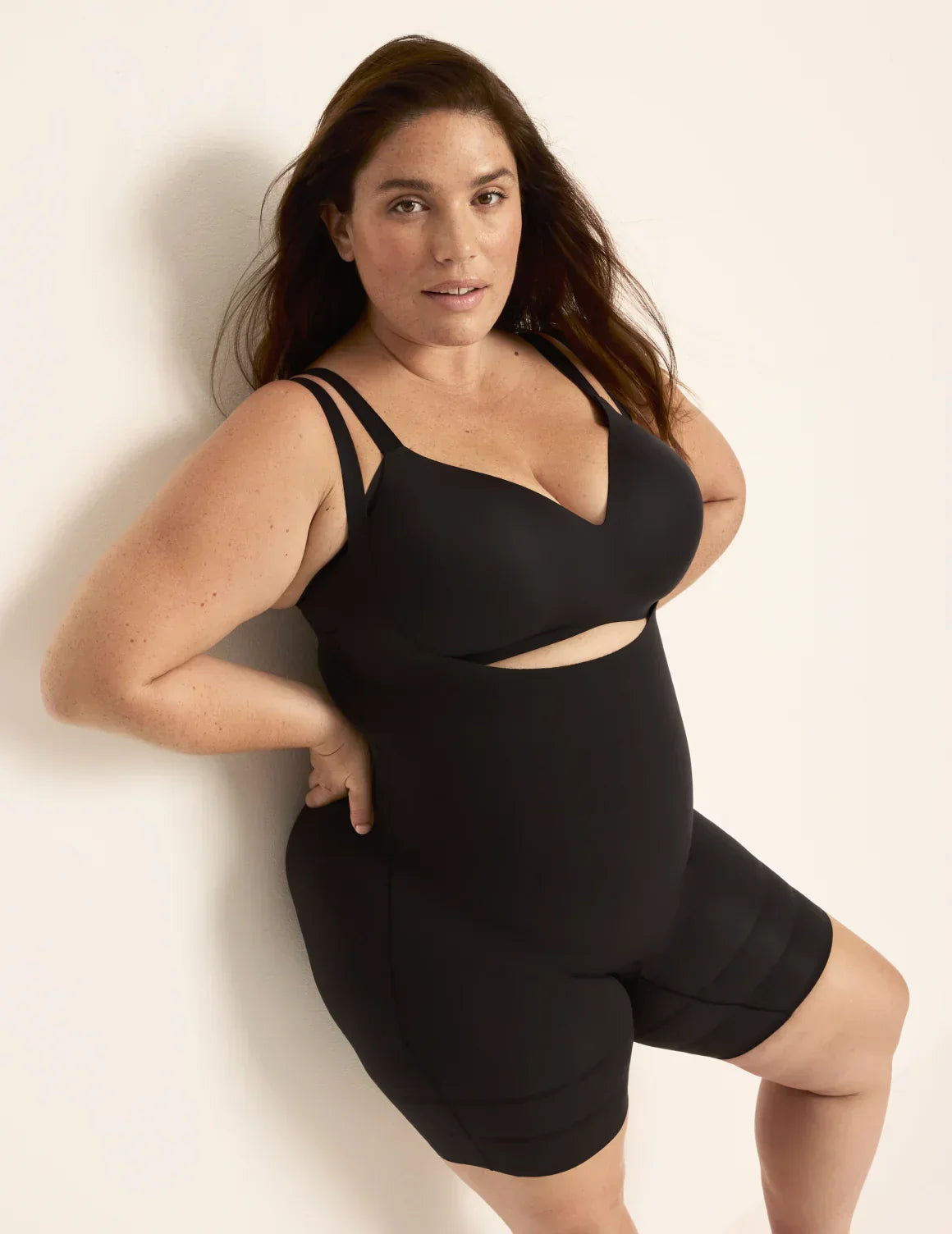 Front view of model wearing the Customizable Open Bust Shaper Bodysuit highlighting the coverage and smooth fit β Black β view 1 of 19