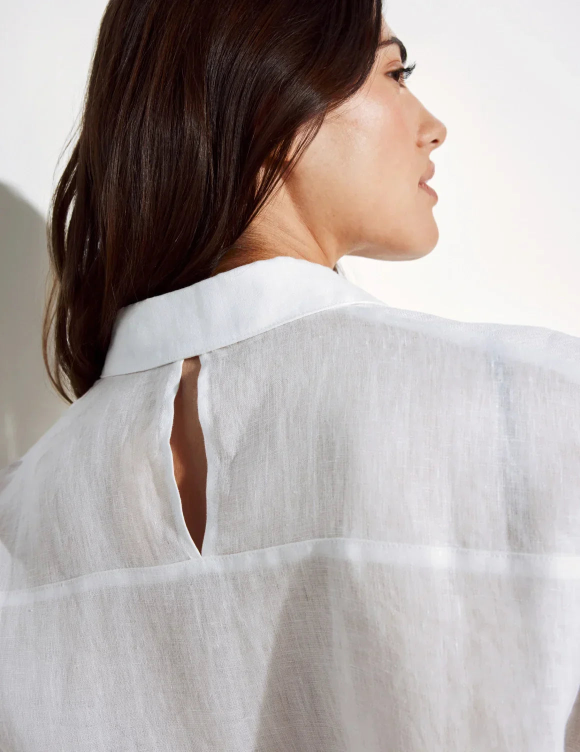 Back view of model wearing the Linen Beach Shirt highlighting the coverage and fit – Ivory – view 11 of 16