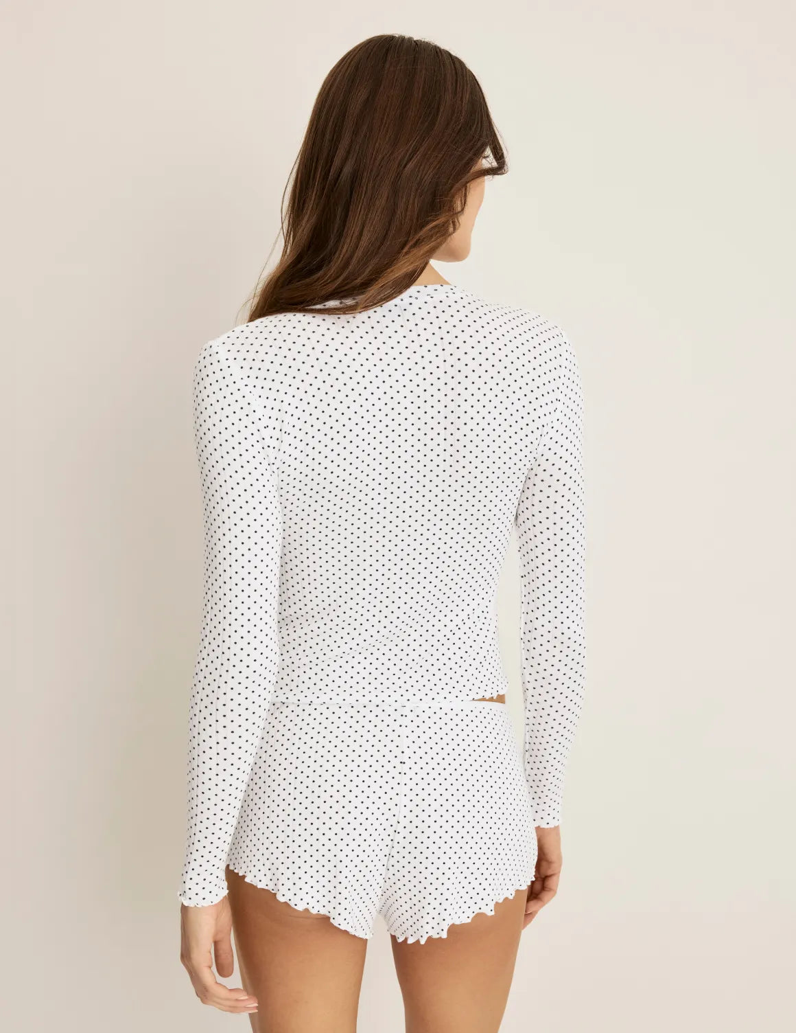 Back view of model wearing the Pointelle Cardigan highlighting the coverage and fit – White with Black Polka Dot – view 7 of 19