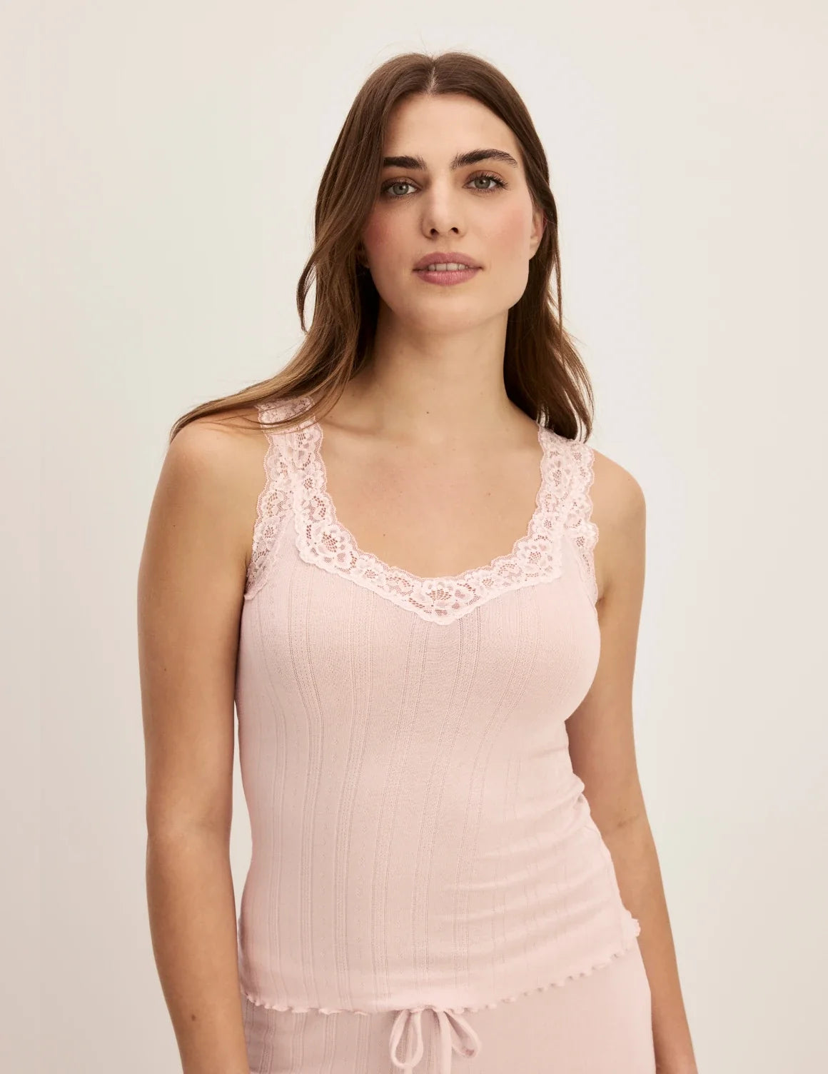 Front view of model wearing the Pointelle Lace Tank highlighting the coverage and fit – Hush – view 1 of 34