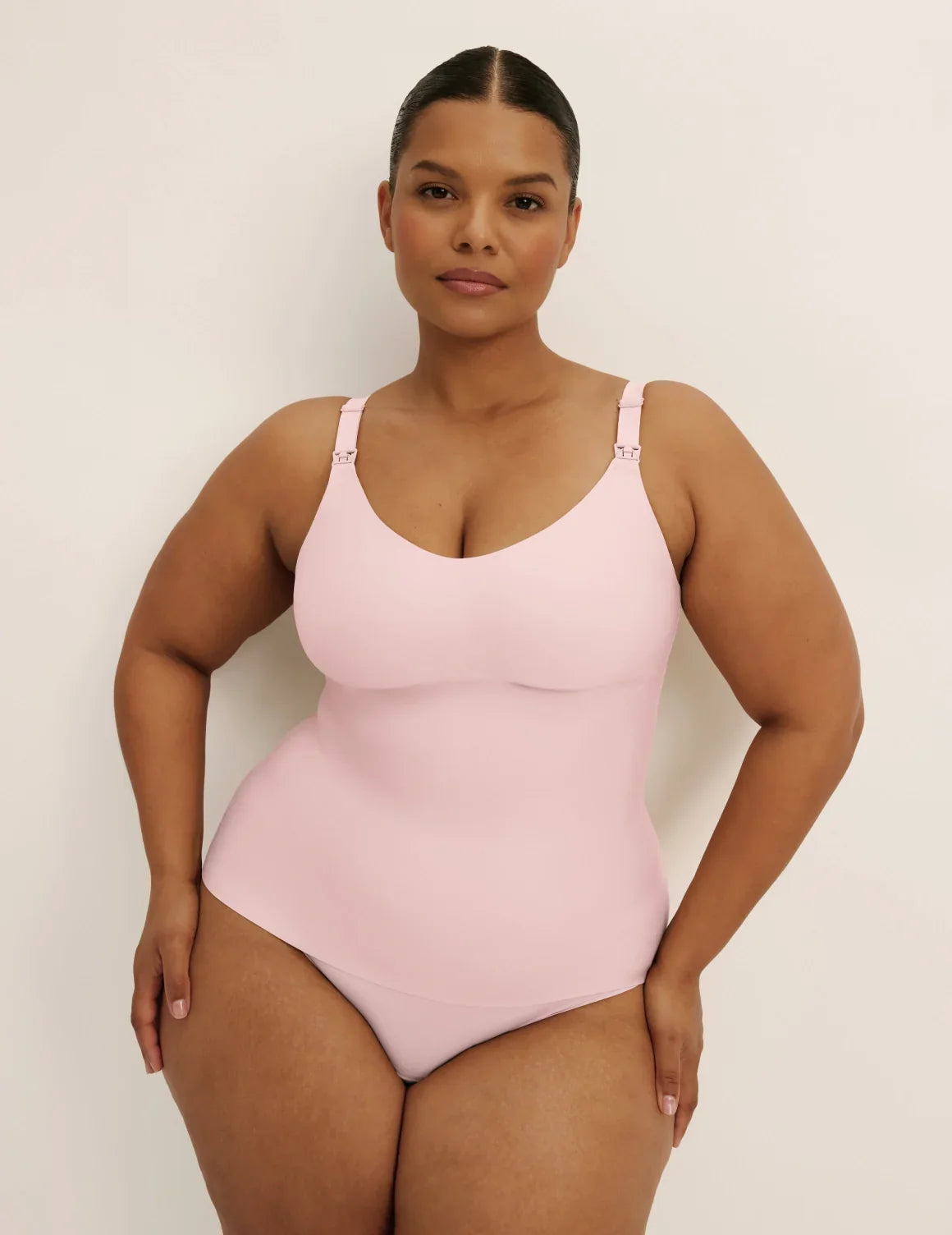 Front view of model wearing the Revolution Nursing Tank, highlighting the neckline, strap design, and smooth silhouette – Rose Water – view 3 of 22