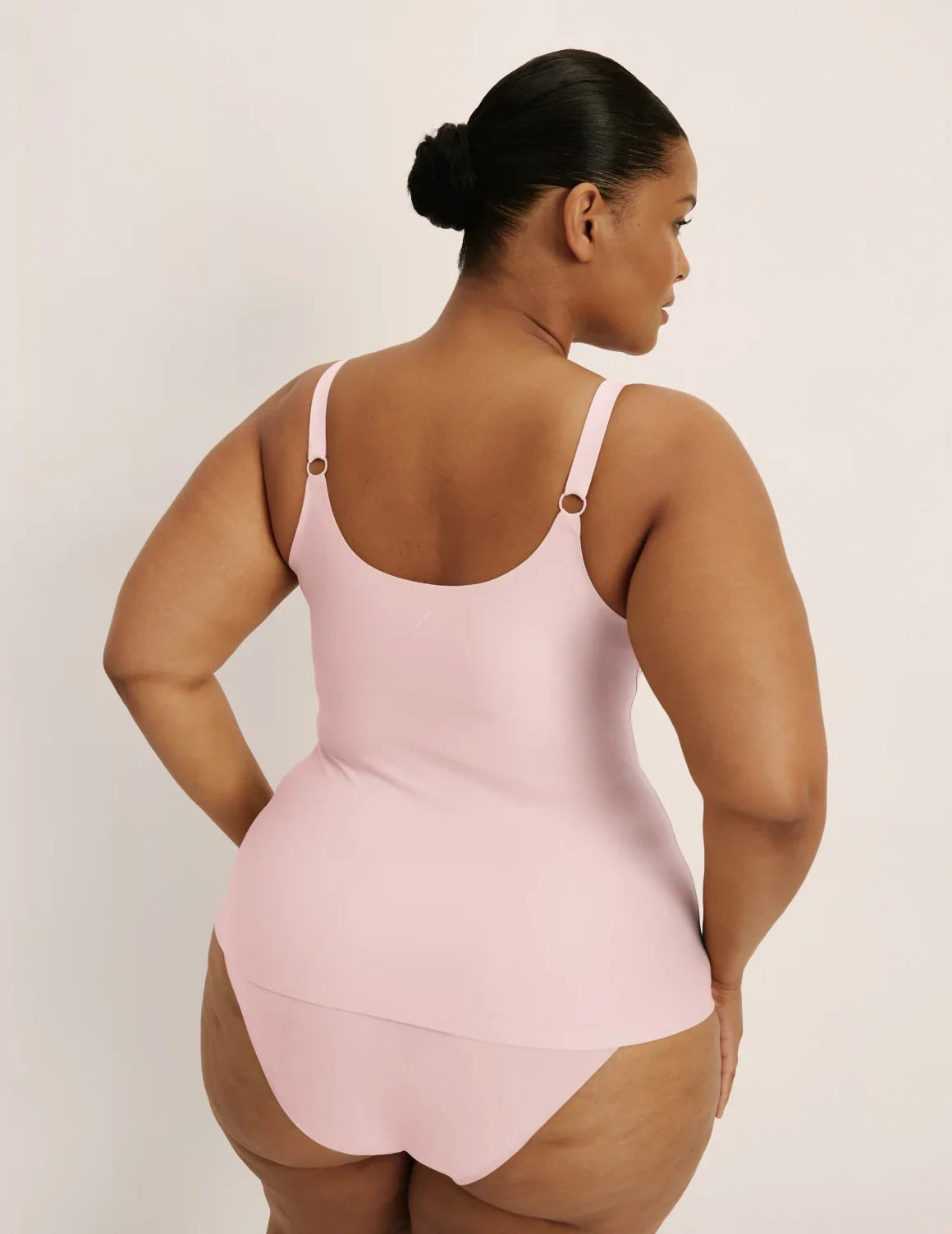 Back view of model wearing the Revolution Nursing Tank, highlighting the neckline, strap design, and smooth silhouette – Rose Water – view 7 of 22