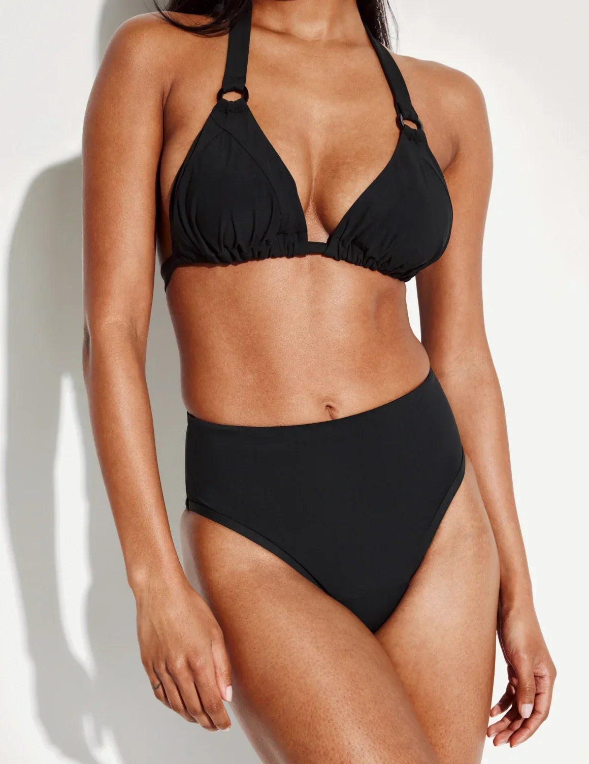 Front view of model wearing the Sculpt High Rise Bikini Swim Bottom highlighting the coverage and fit – Black – view 10 of 36