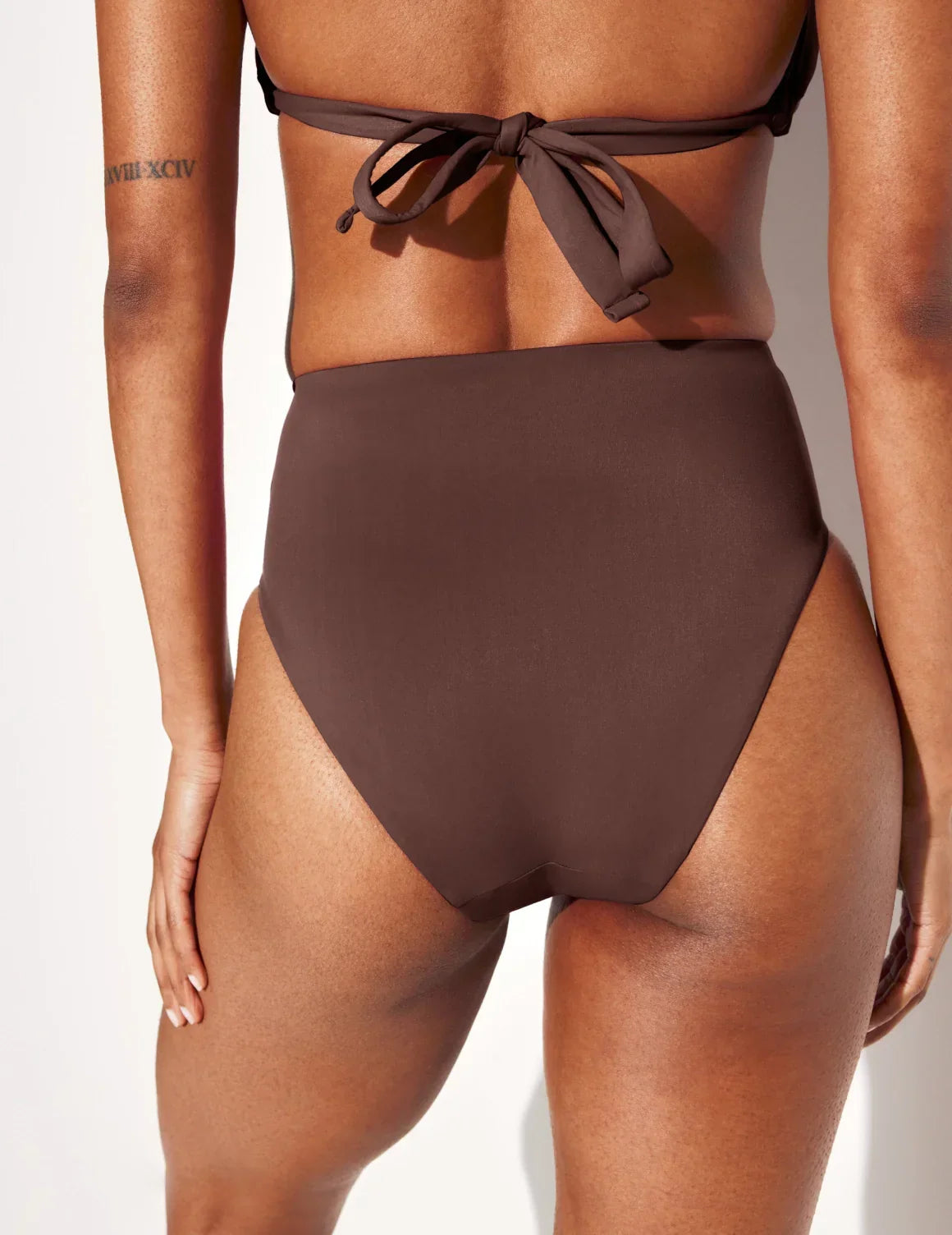 Back view of model wearing the Sculpt High Rise Bikini Swim Bottom highlighting the coverage and fit – Espresso – view 9 of 36