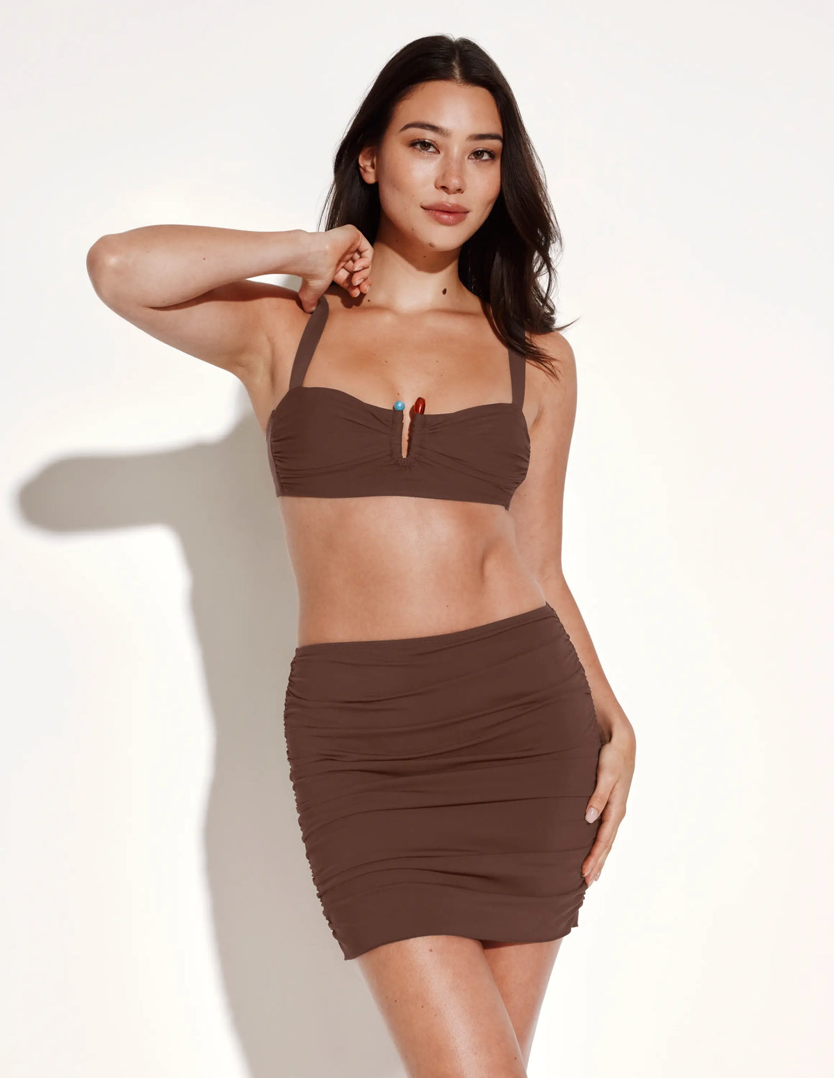 Front view of model wearing the Sculpt Ruched Swim Skirt highlighting the coverage and fit – Espresso – view 9 of 9
