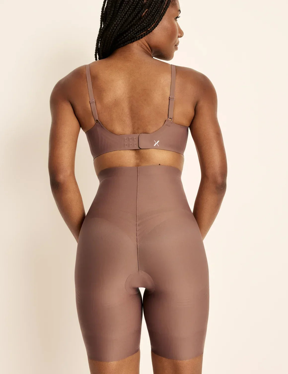 Back view of model wearing the Customizable Shaper High Rise Leakproof Shorts, highlighting the coverage and smooth fit – Sola – view 8 of 18