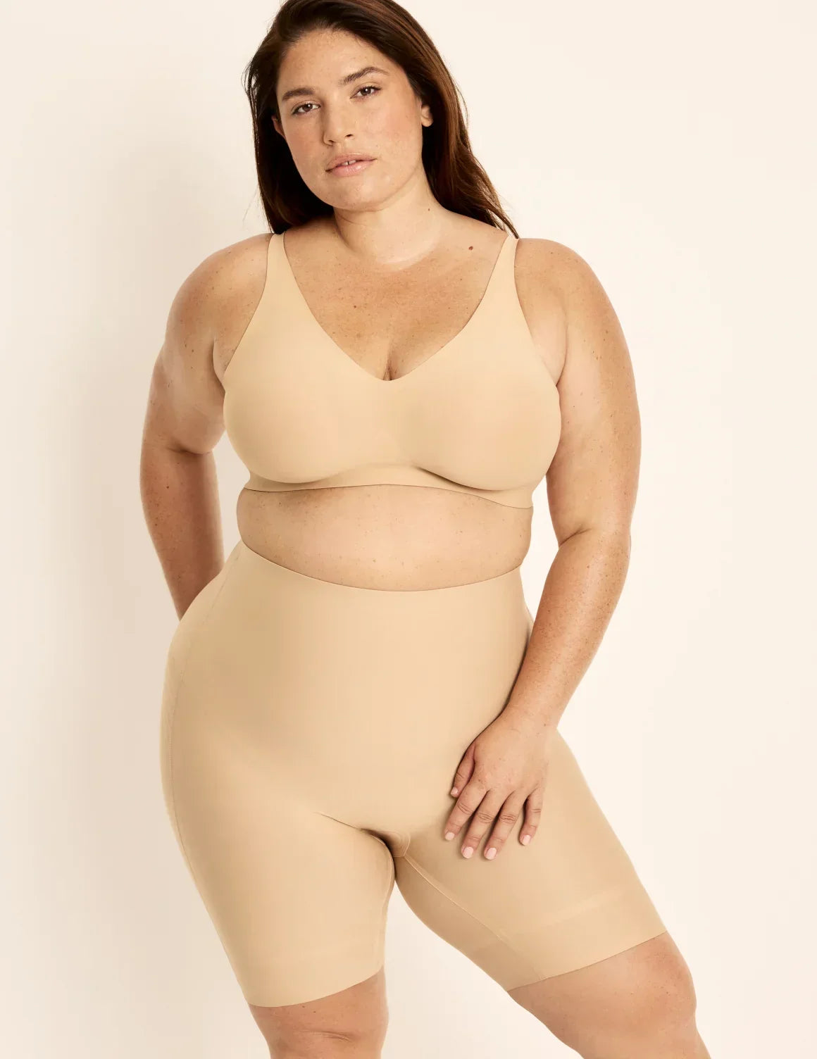 Front view of model wearing the Customizable Shaper High Rise Leakproof Shorts, highlighting the coverage and smooth fit – Warm Sand – view 3 of 18