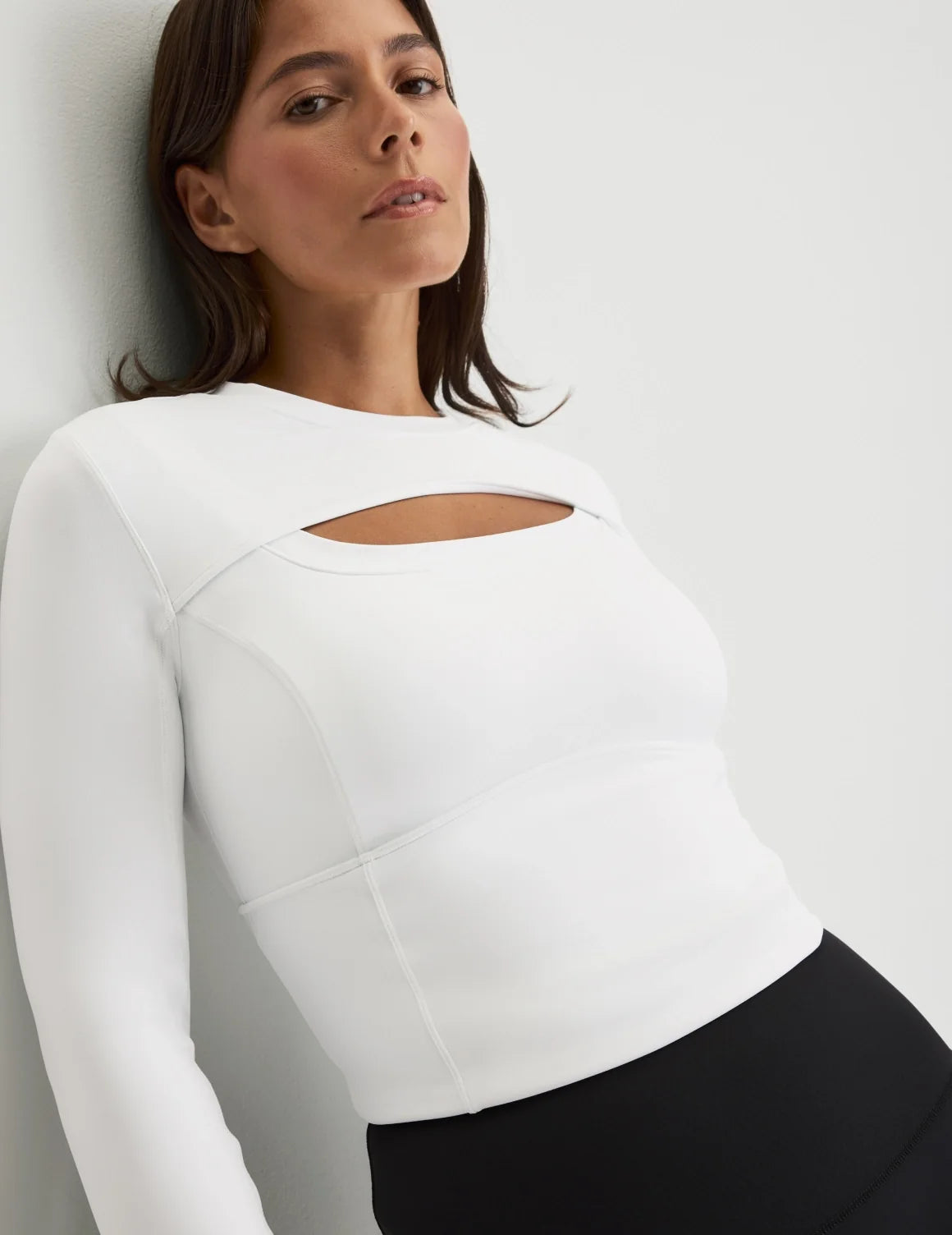 Front view of model wearing the Studio Cutout Bra Top, highlighting the keyhole neckline, flattering design, and silhouette – White – view 5 of 8