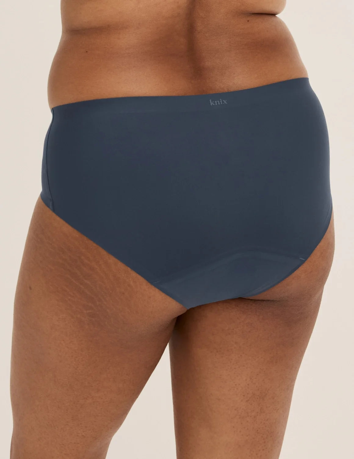 Back view of model wearing the Super Leakproof® No-Show Boyshort highlighting the coverage and smooth fit – Twilight Navy – view 6 of 28