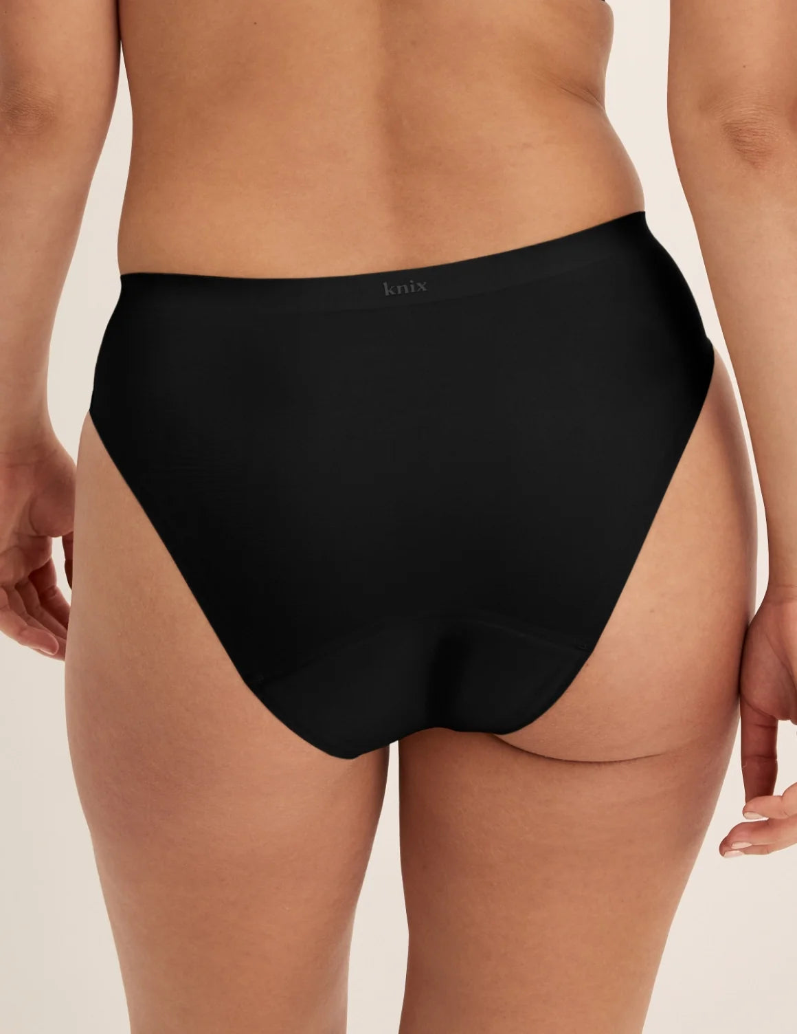 Back view of model wearing the Super Leakproof® No-Show French Cut highlighting the coverage and smooth fit – Black – view 3 of 27