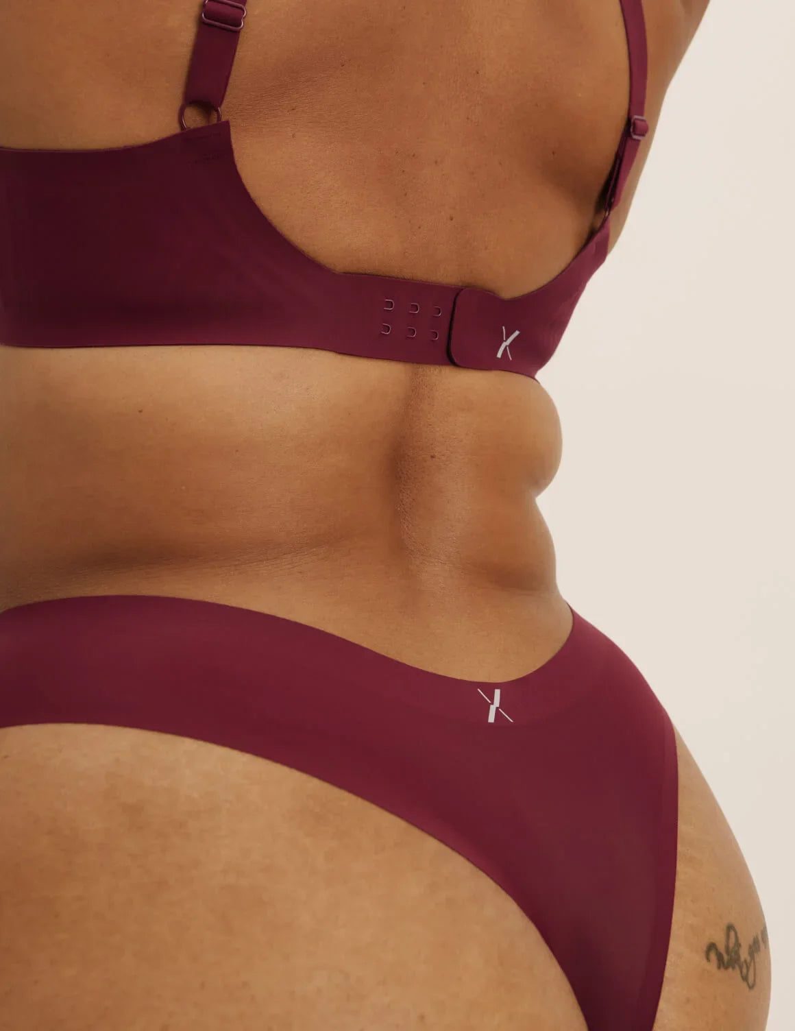 Back view of model wearing the Super Leakproof® No-Show Thong highlighting the coverage and smooth fit – Dark Cherry – view 12 of 28