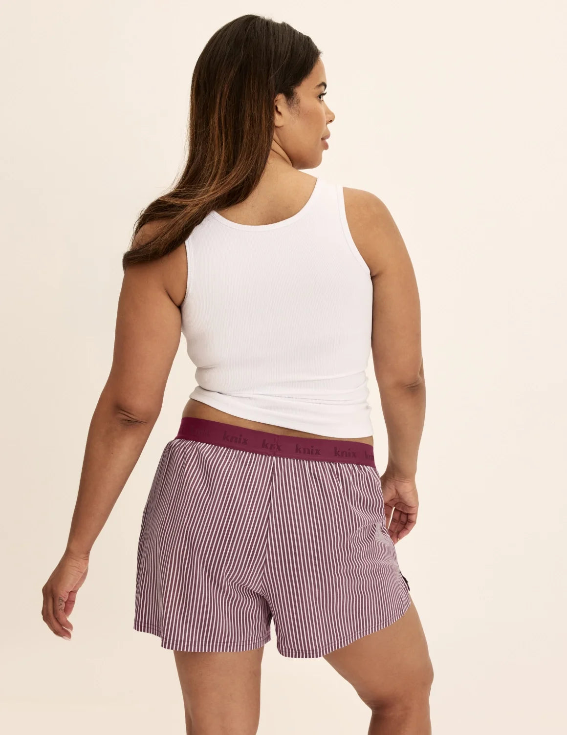 Back view of model wearing the Super Leakproof® Dream Boxer™ highlighting the coverage and fit – Dark Cherry Stripe – view 12 of 63