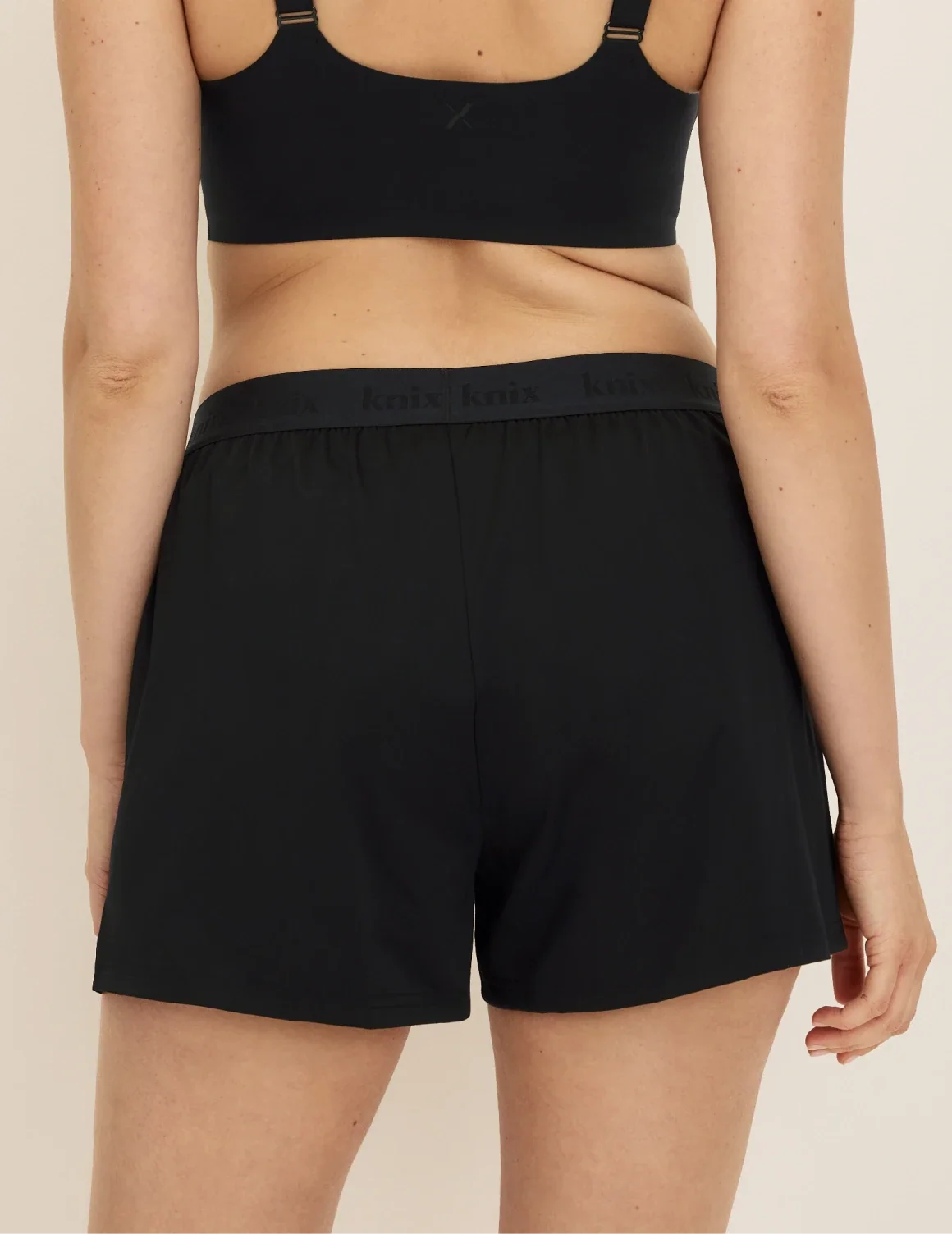 Back view of model wearing the Super Leakproof® Dream Boxer™ highlighting the coverage and fit – Black – view 4 of 63