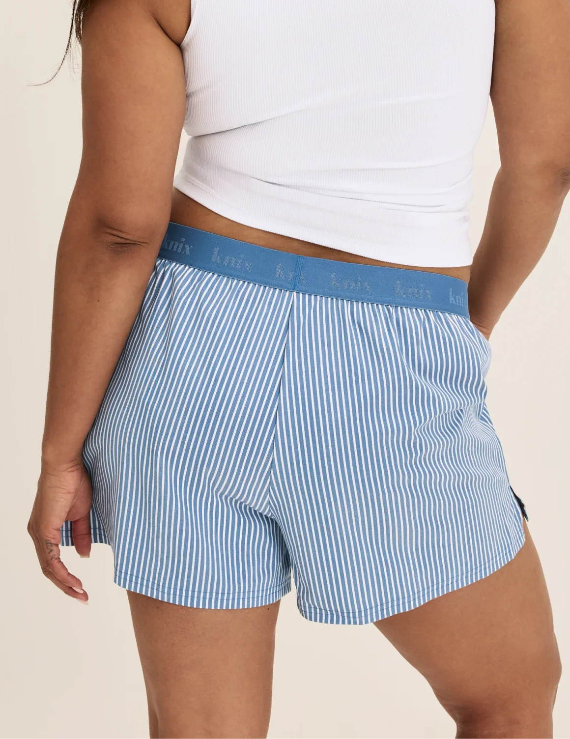 Back view of model wearing the Super Leakproof® Dream Boxer™ highlighting the coverage and fit – Blue Stripe – view 10 of 63
