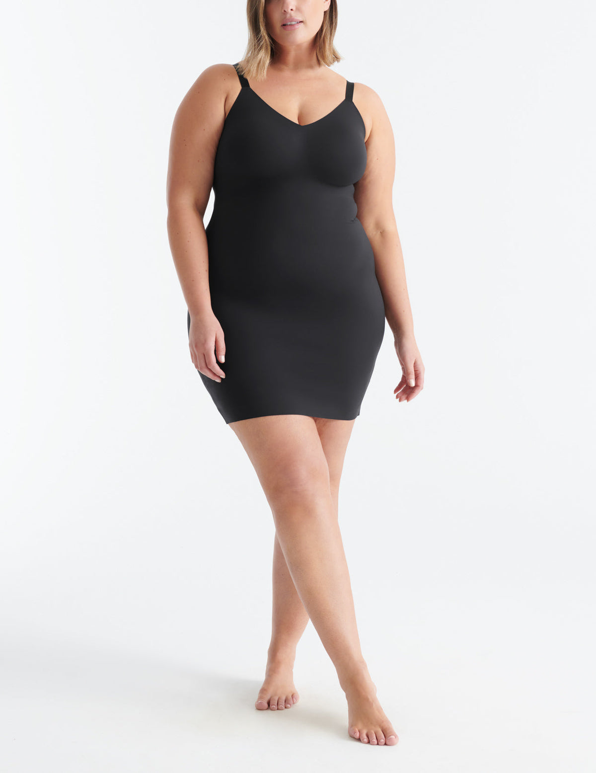 Front view of model wearing the LuxeLift Slip highlighting the neckline, strap design and fit – Black – view 1 of 15