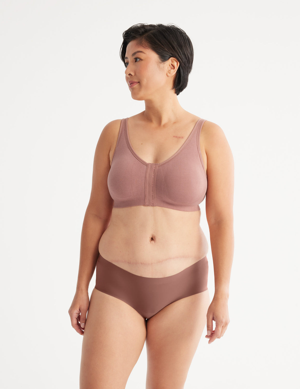 Full-body view of model wearing the Ultra Soft Front Closure Bra, highlighting the neckline, easy front closure, and seamless knit silhouette – Bisque – view 6 of 13