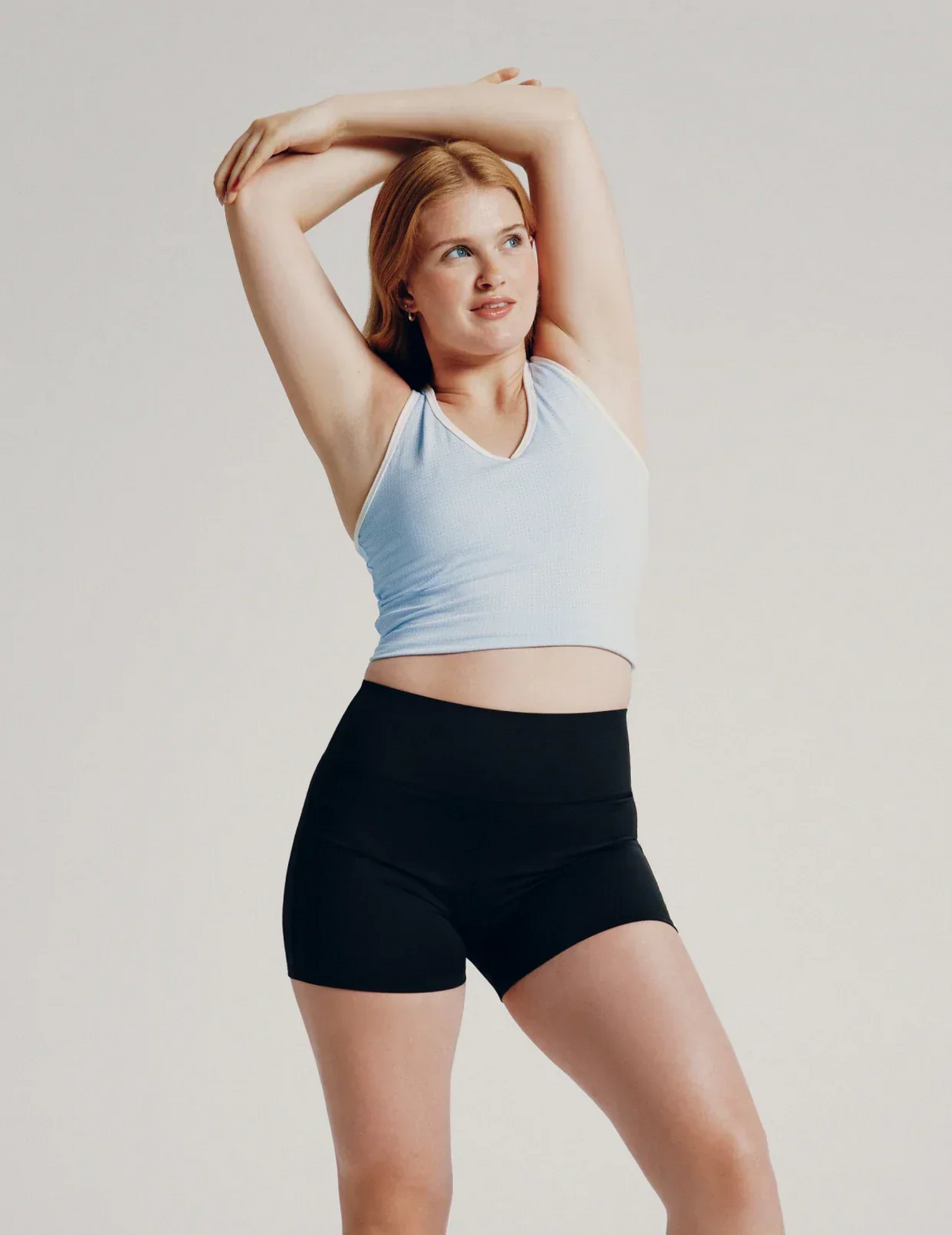 Front view of model wearing the Teen Leakproof Active Short highlighting the coverage and fit – Black – view 1 of 7