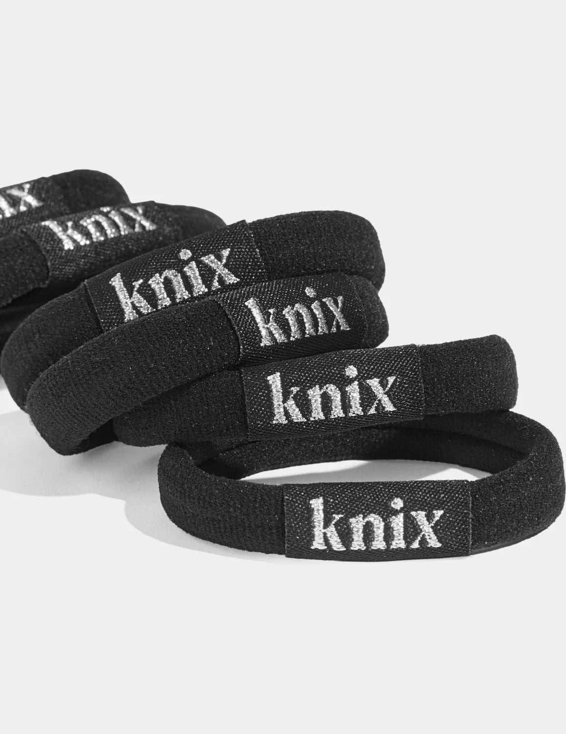 Close-up of Logo on the No-Slip Hair Ties 6-Pack shown front-facing against a light gray background – Black – view 2 of 2