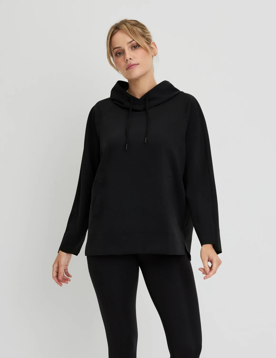 Front view of model wearing the CloudCut™ Hoodie highlighting the coverage and fit – Black – view 1 of 15
