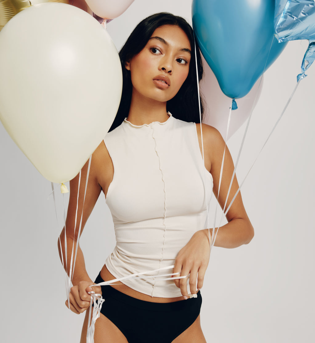 Front view of model wearing the Teen Leakproof Cotton Bikini highlighting the coverage and fit – Black – view 4 of 11