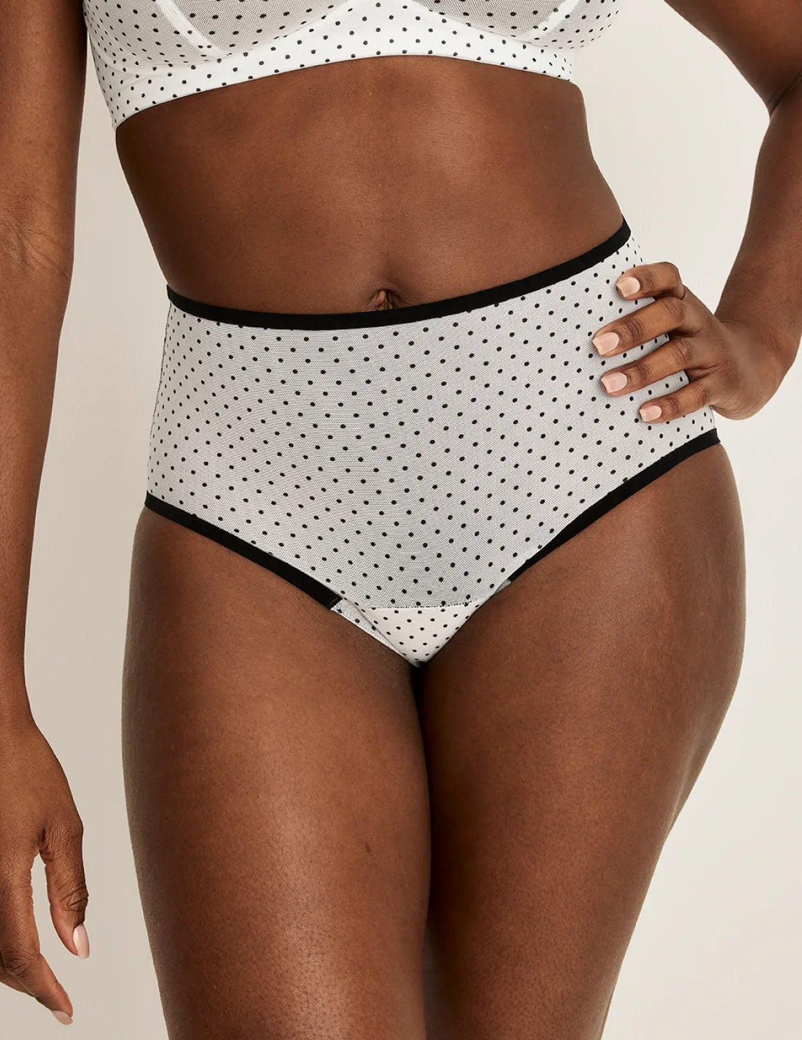 Front view of model wearing the Essential Full Mesh High Rise highlighting the coverage and smooth fit – White with Black Polka Dot – view 1 of 12