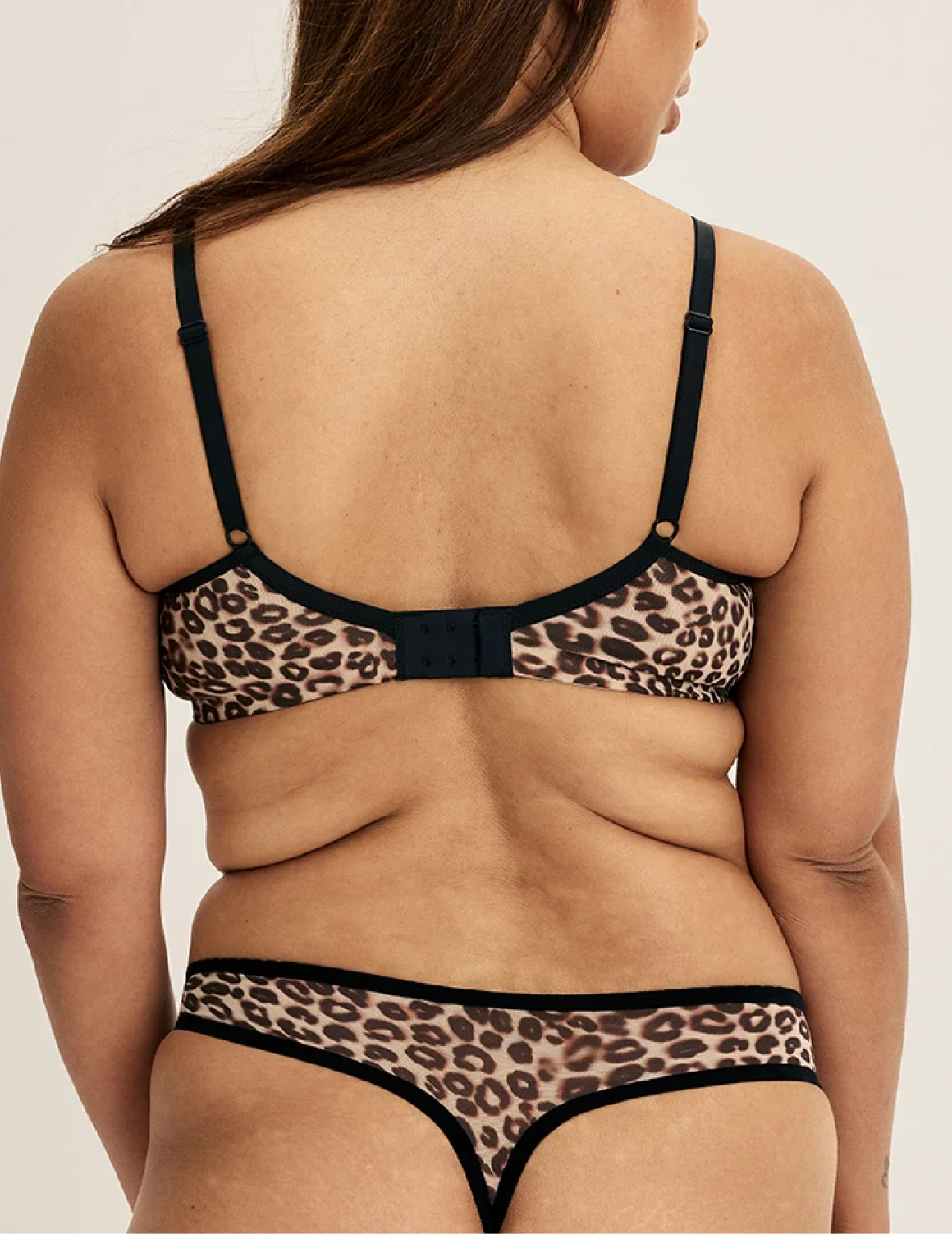 Back view of model wearing the Essential Full Mesh Thong highlighting the coverage and smooth fit – Cheetah Print – view 12 of 13