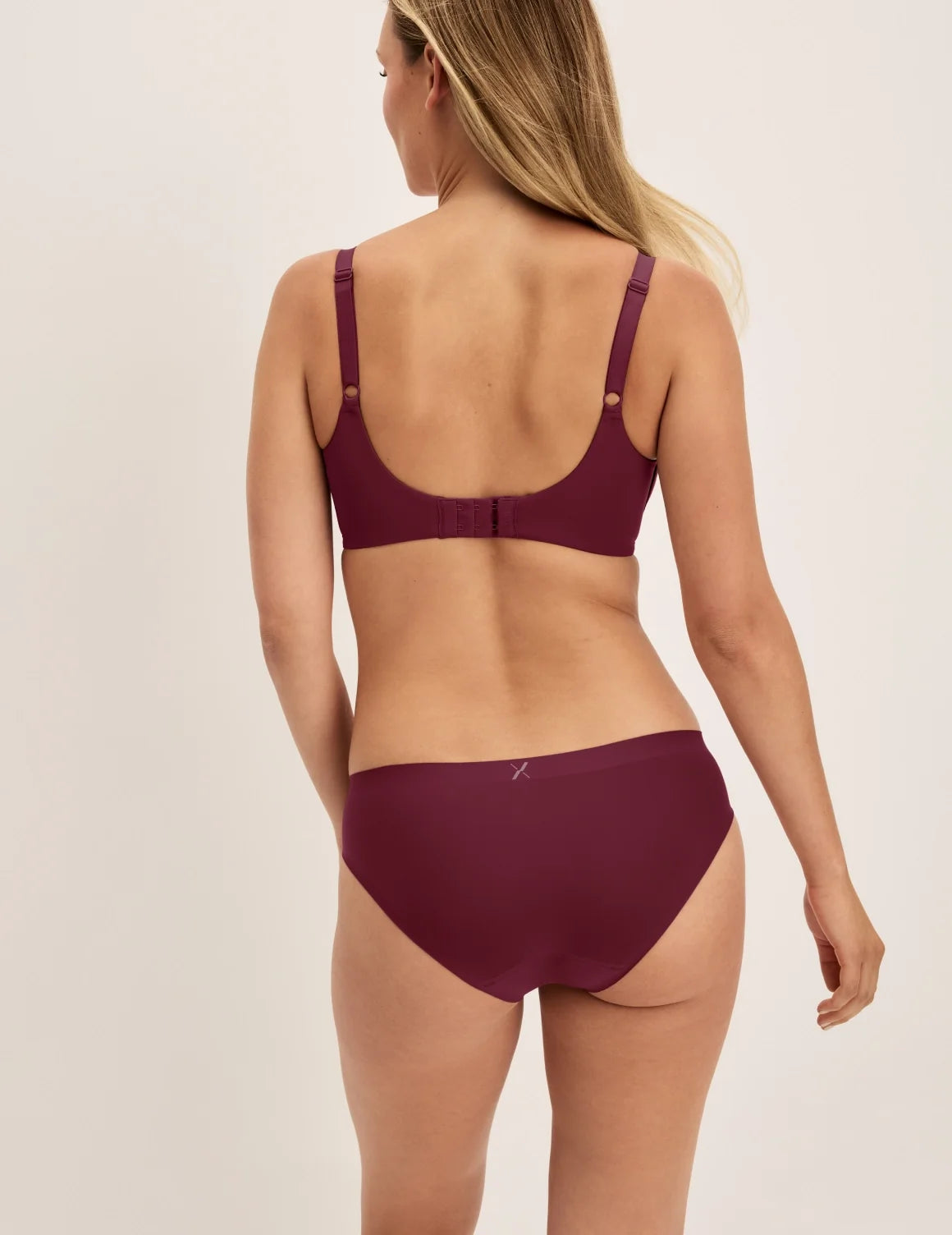 Back view of model wearing the Essential No-Show Bikini highlighting the coverage and smooth fit – Pink Multi – view 4 of 18