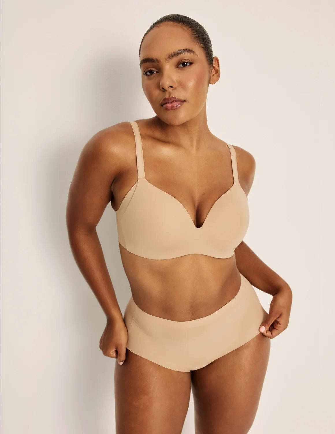 Front view of model wearing the Essential No-Show High Rise highlighting the coverage and smooth fit – Nude Multi – view 3 of 16