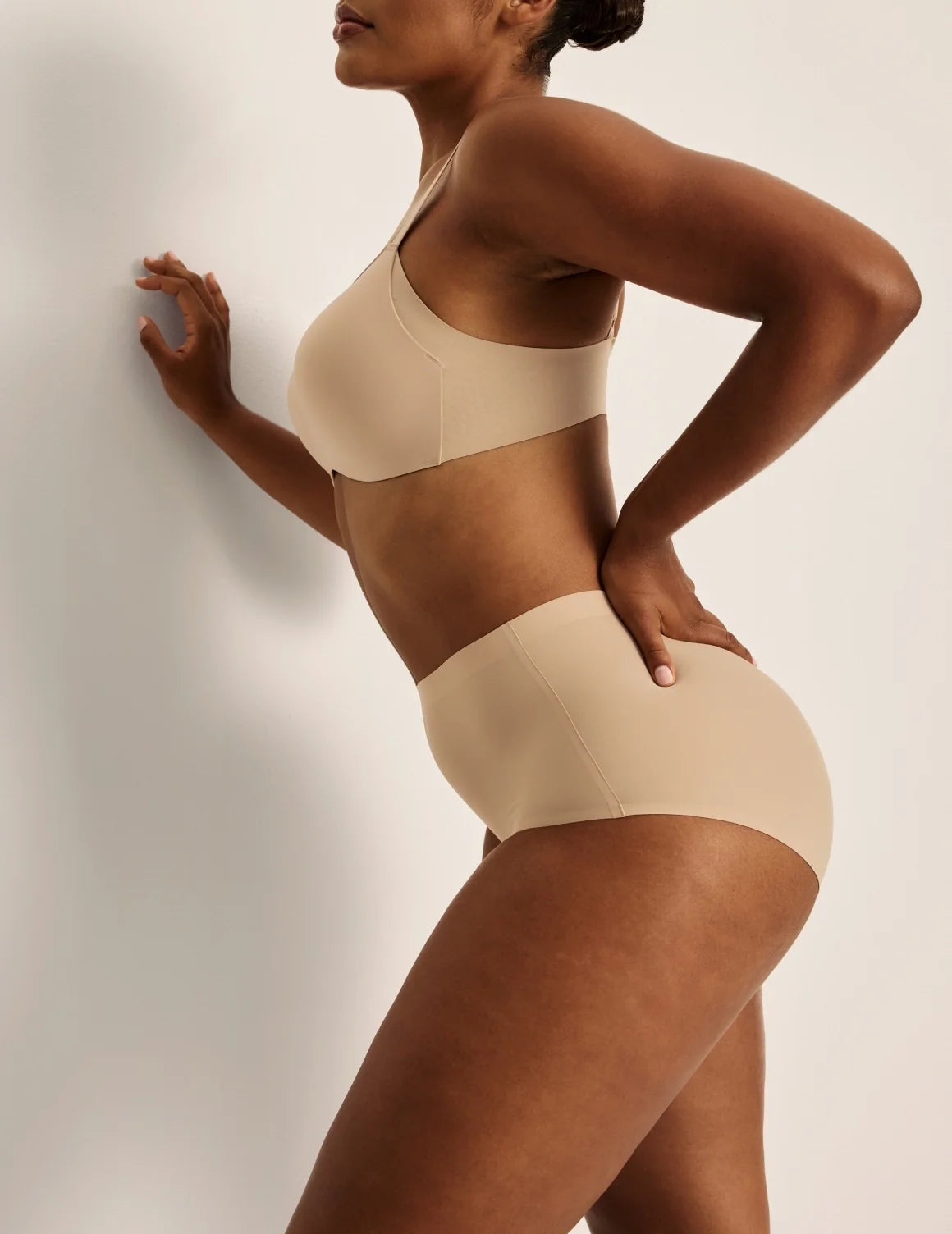 Side view of model wearing the Essential No-Show High Rise highlighting the coverage and smooth fit – Nude Multi – view 4 of 16