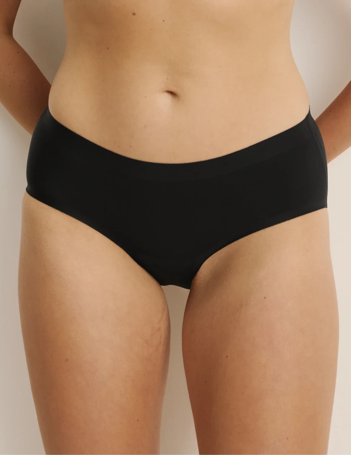Front view of model wearing the Essential No-Show Boyshort highlighting the coverage and smooth fit – Black – view 5 of 27