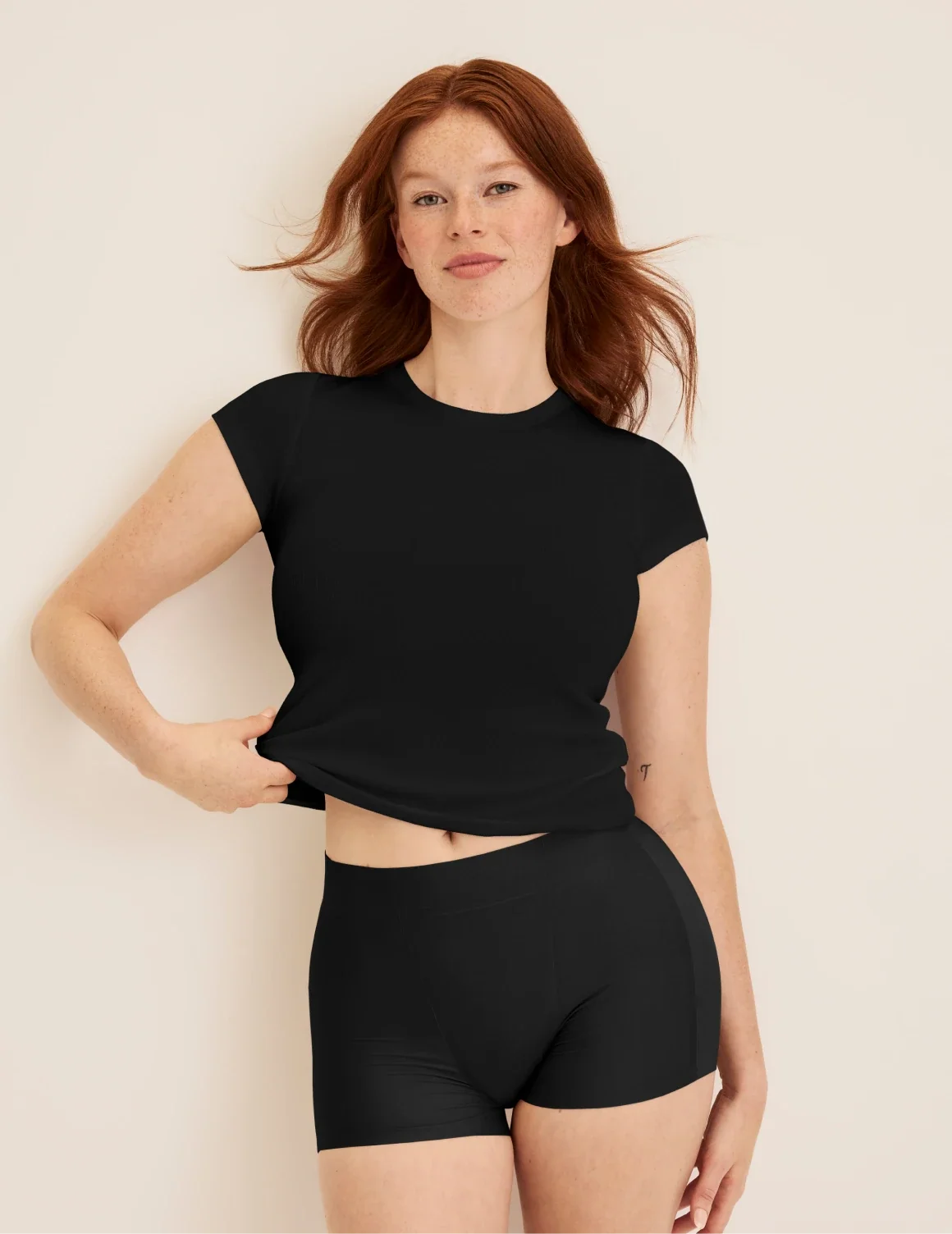 Full-body view of model wearing the SuperPlus Leakproof® Dream Short highlighting the coverage and smooth fit – Black – view 5 of 36