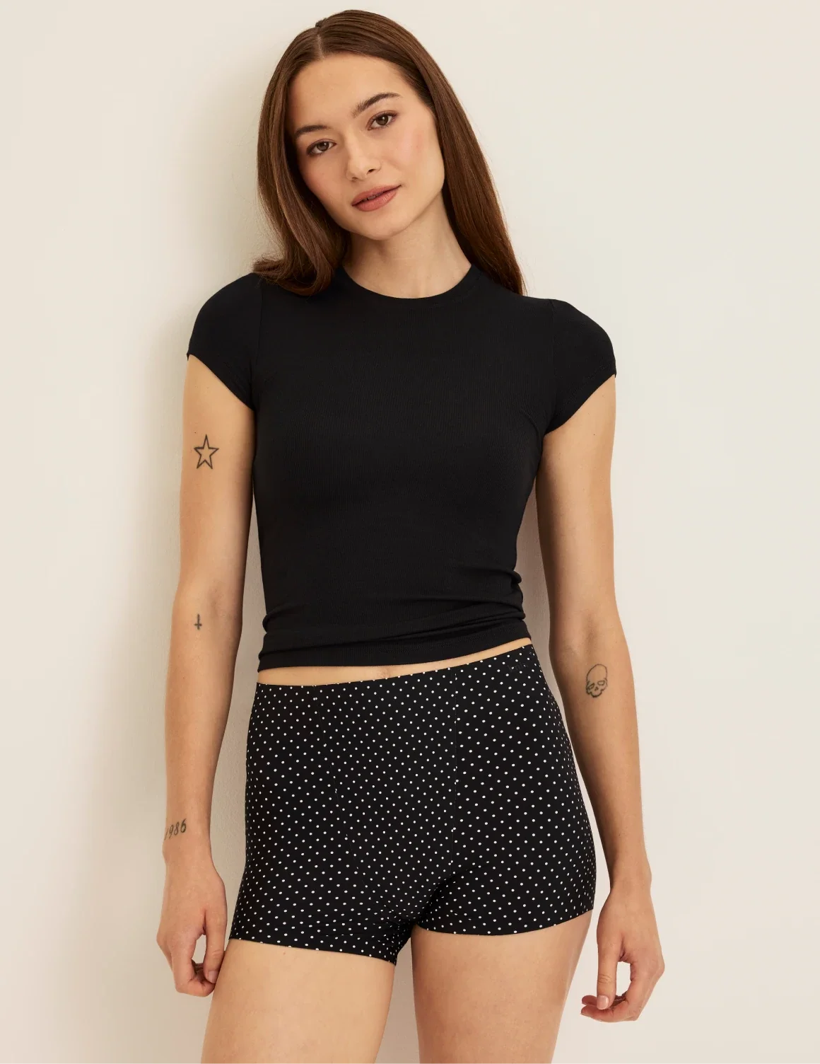 Full-body view of model wearing the SuperPlus Leakproof® Dream Short highlighting the coverage and smooth fit – Black with White Polka Dot – view 10 of 36
