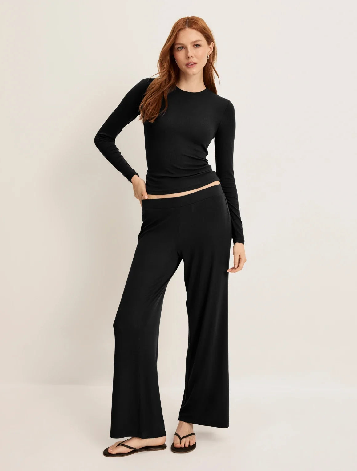 Front view of model wearing the Modal Rib Pant highlighting the coverage and fit – Black – view 1 of 13