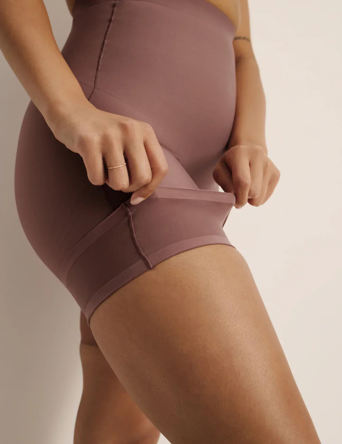 View of model wearing the Customizable Shaper High Rise Shorts, highlighting the customizable PerfectCut™ lines, coverage and smooth fit – Sola – view 12 of 15