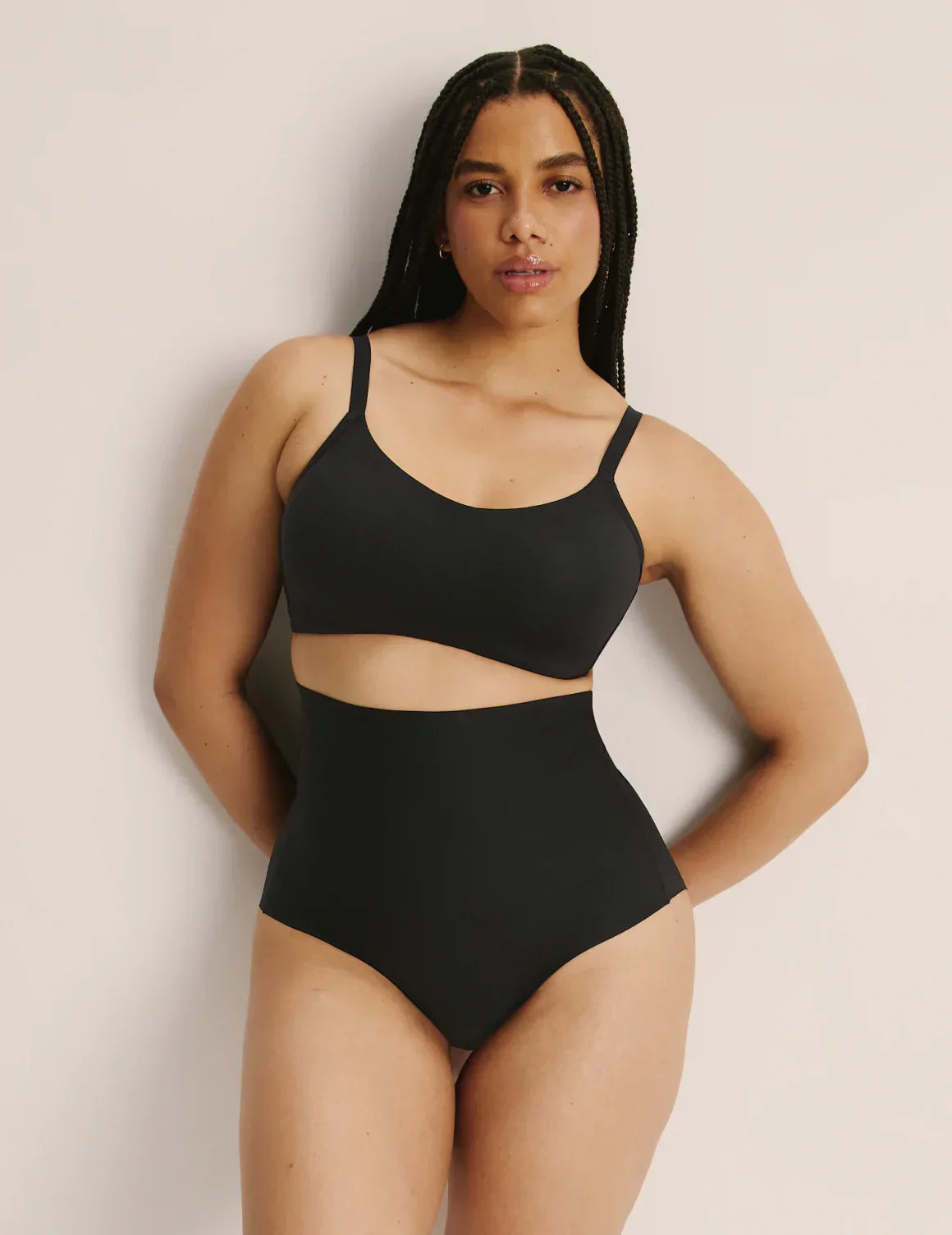 Full-body view of model wearing the Shaper High Rise Briefs, highlighting the coverage and smooth fit – Black – view 1 of 12