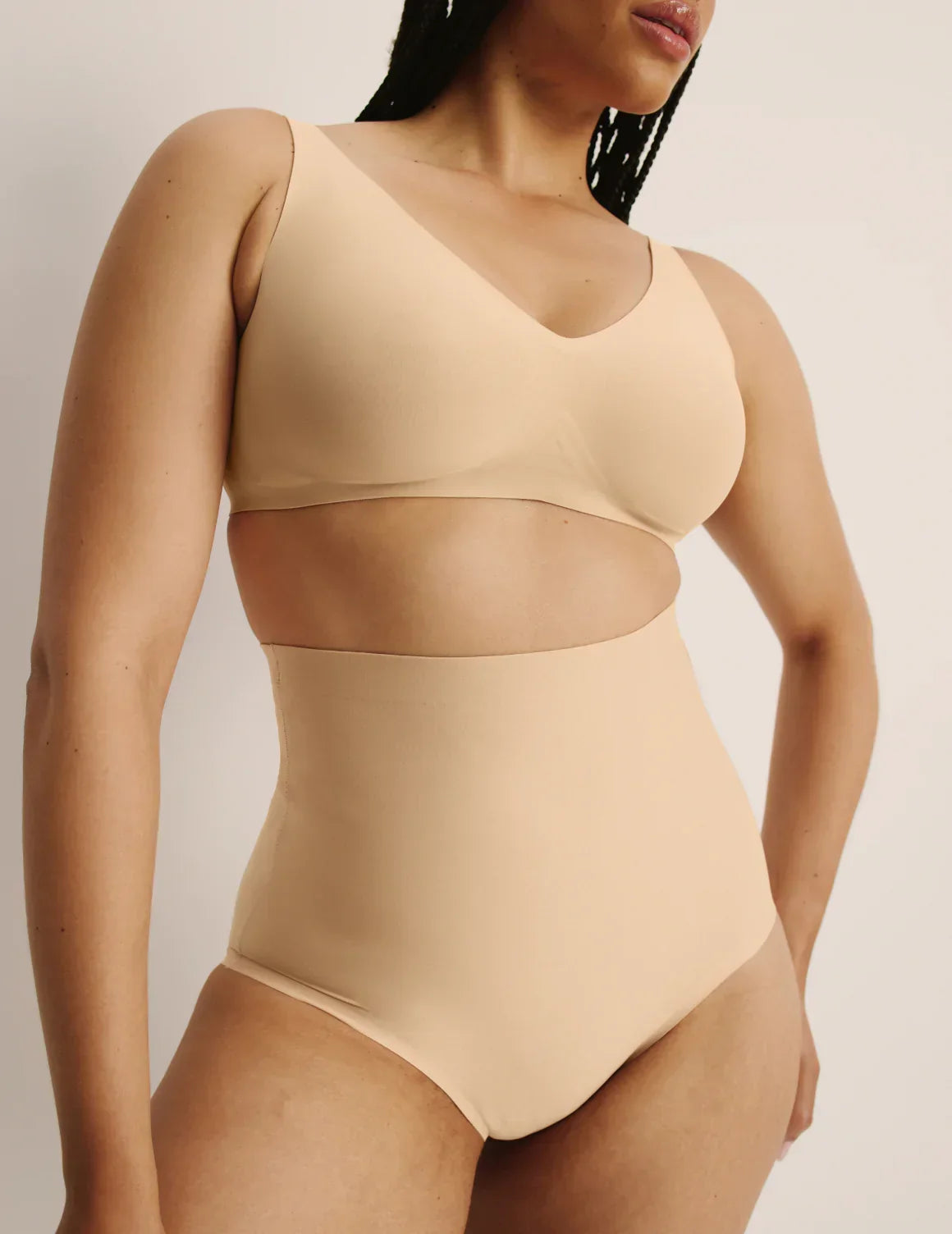 Front view of model wearing the Shaper High Rise Briefs, highlighting the coverage and smooth fit – Warm Sand – view 12 of 12