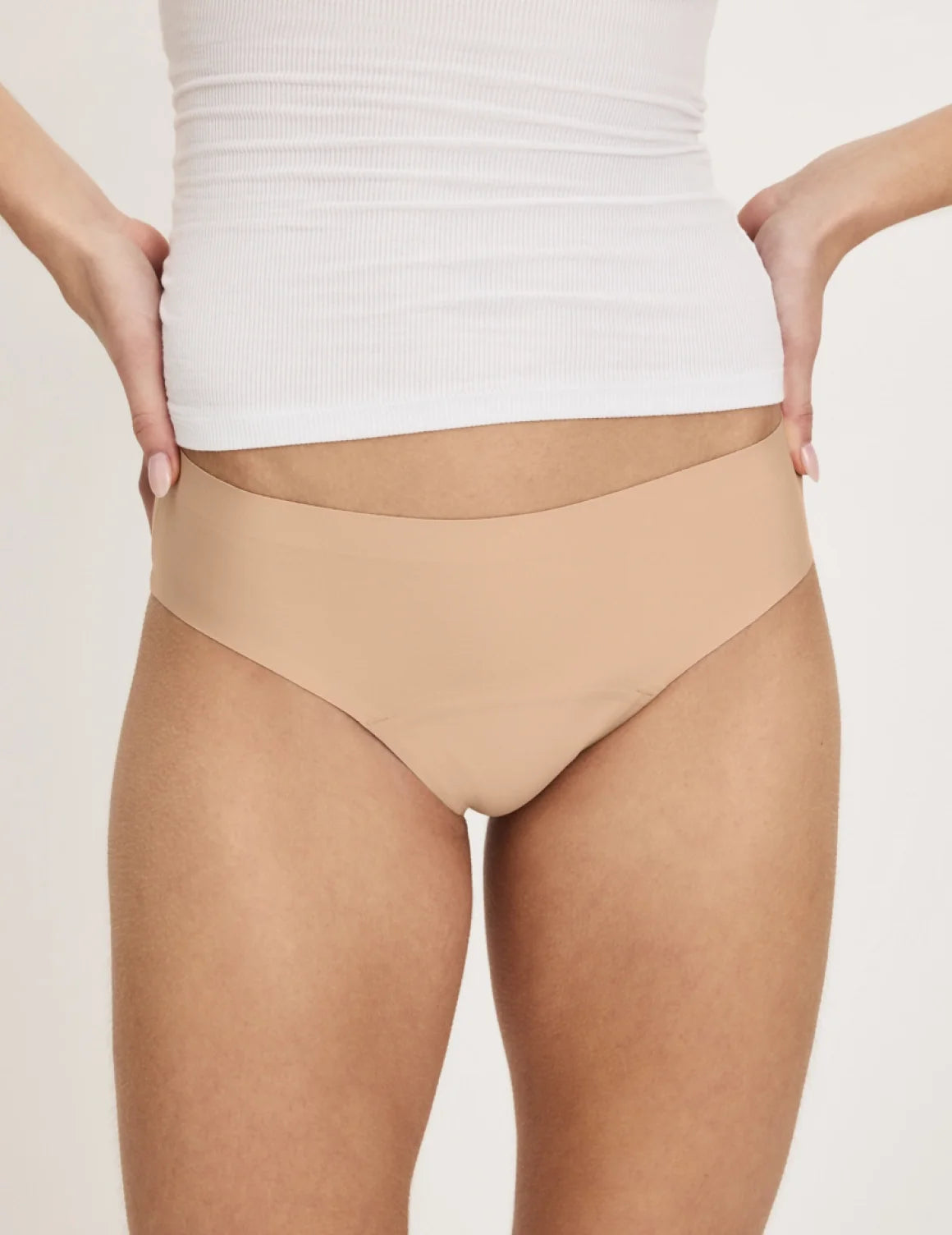 Front view of model wearing the Teen Super Leakproof® No-Show Bikini highlighting the coverage and smooth fit – Warm Sand – view 12 of 49
