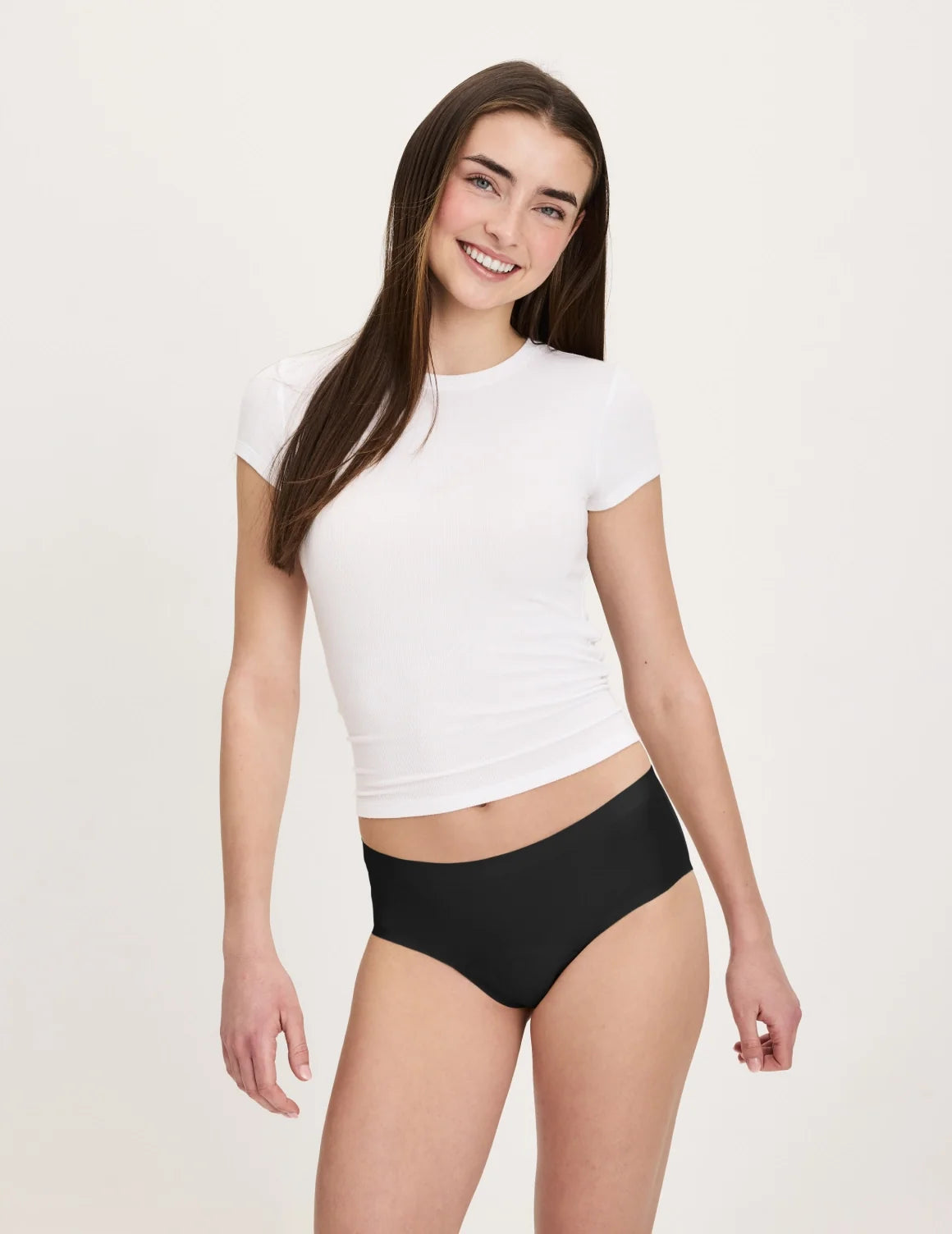 Front view of model wearing the Teen Super Leakproof® No-Show Boyshort highlighting the coverage and smooth fit – Black – view 1 of 48