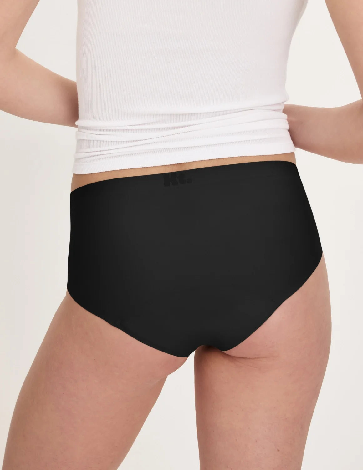 Back view of model wearing the Teen Super Leakproof® No-Show Boyshort highlighting the coverage and smooth fit – Black – view 4 of 48