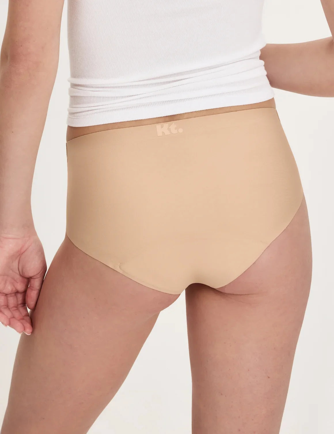 Back view of model wearing the Teen Super Leakproof® No-Show Boyshort highlighting the coverage and smooth fit – Warm Sand – view 12 of 48