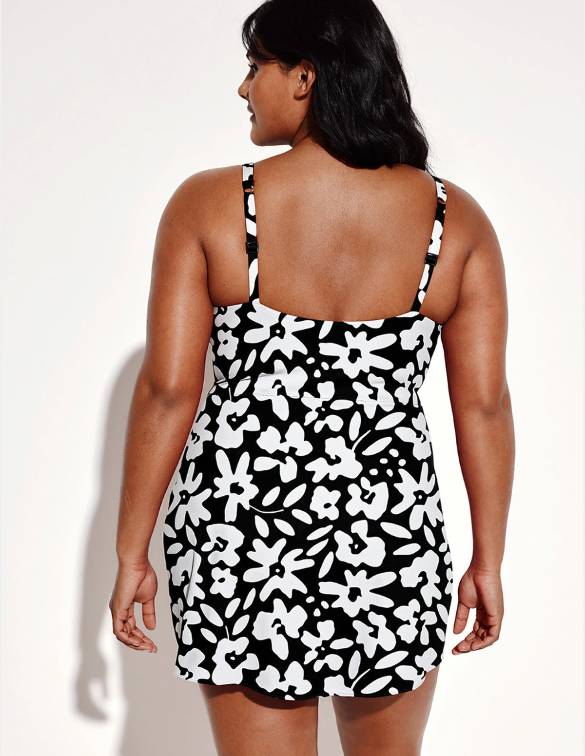 Back view of model wearing the Leakproof Sculpt Deep V Swim Dress highlighting the coverage and fit – Jasmine Dusk – view 10 of 12
