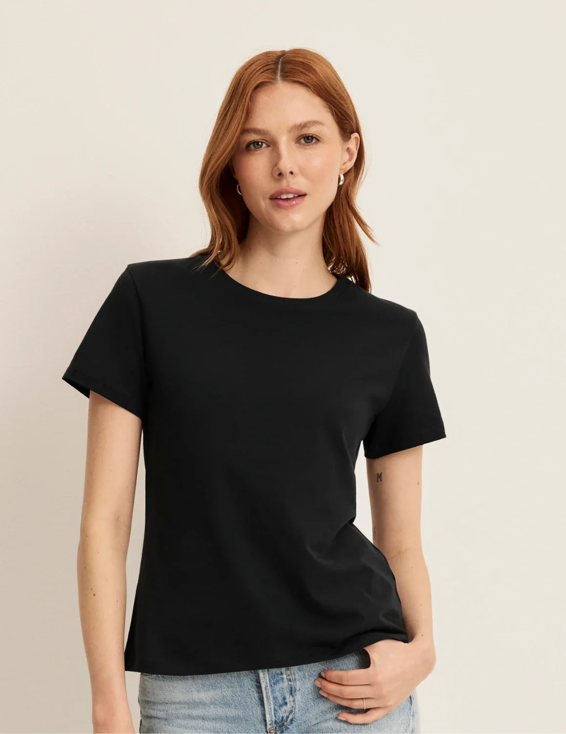 Front view of model wearing the Cotton Relaxed T-Shirt highlighting the coverage and fit – Black – view 6 of 20