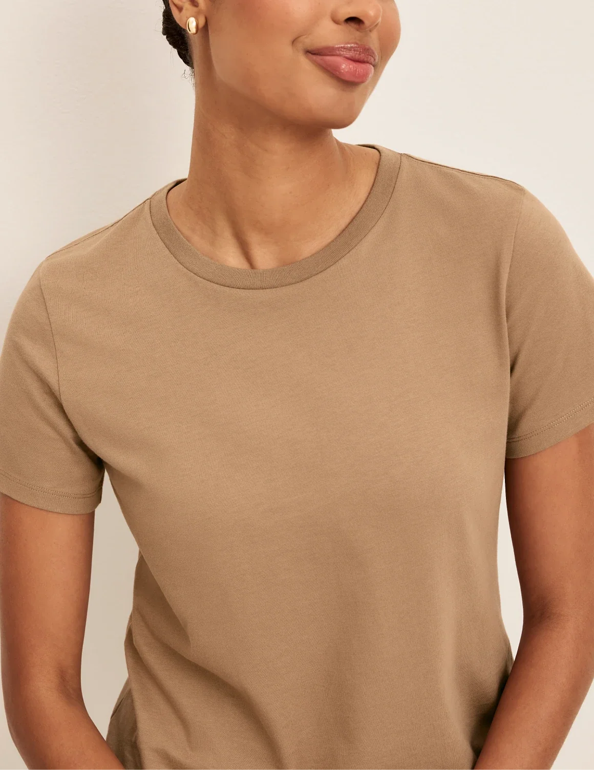 Front view of model wearing the Cotton Relaxed T-Shirt highlighting the coverage and fit – Cashew – view 4 of 20