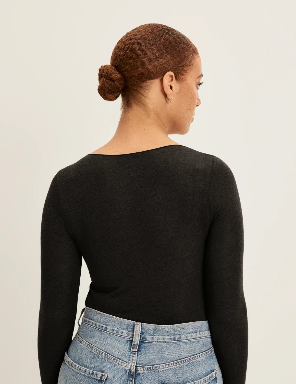 Back view of model wearing the Cashmere Mist Scoop Top highlighting the neckline and fit – Black – view 3 of 17