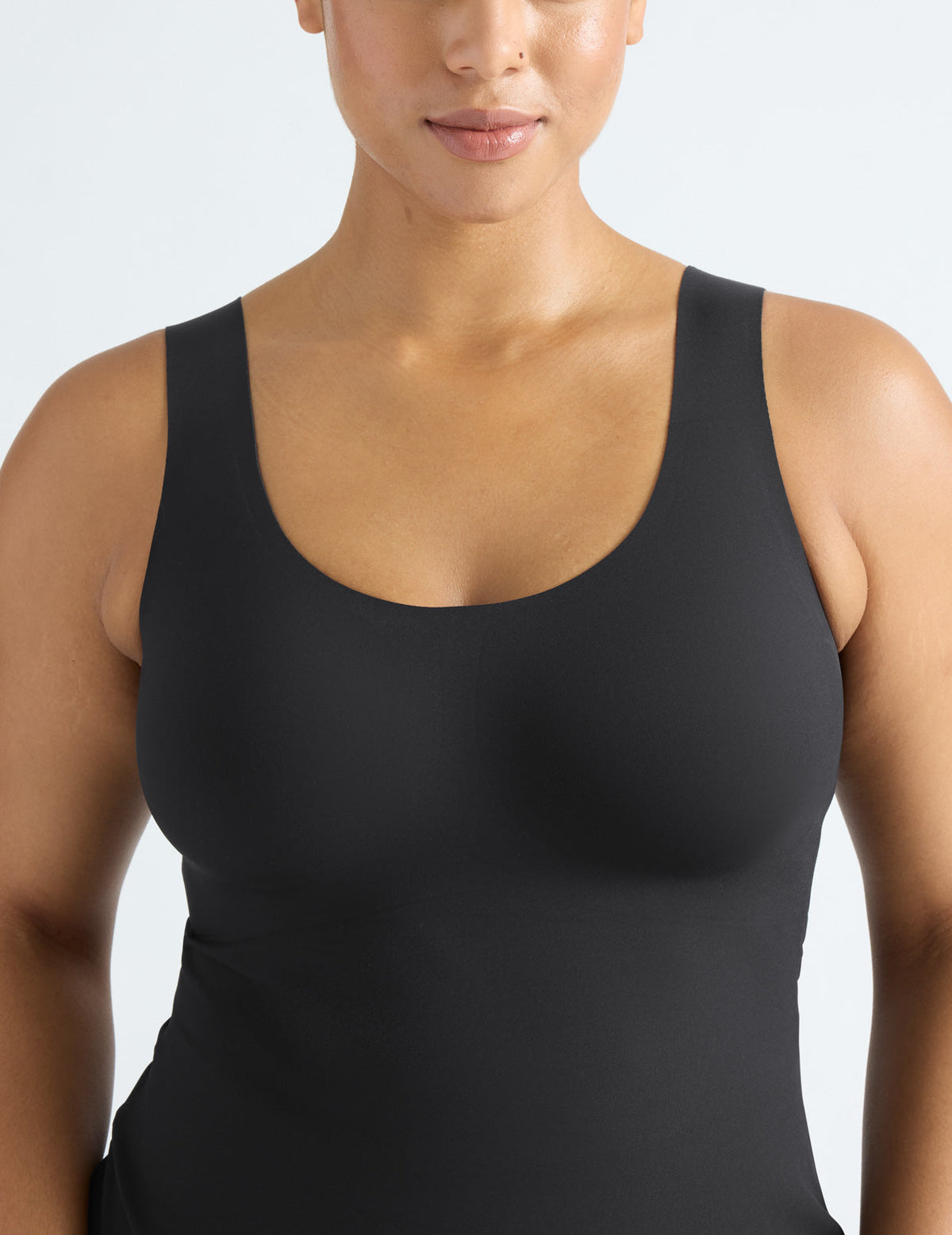 Front view of model wearing the LuxeLift Scoop Neck Tank, highlighting the neckline, strap design, and silhouette – Black – view 9 of 20