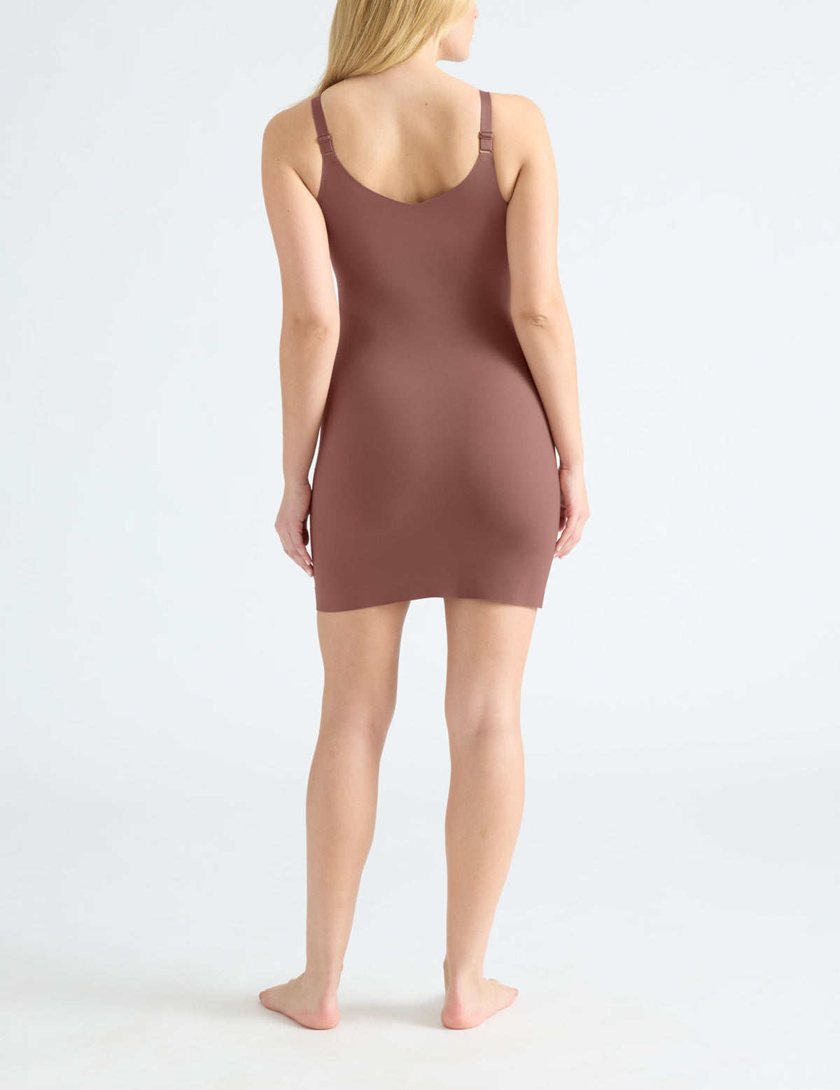 Back view of model wearing the LuxeLift Slip highlighting the neckline, strap design and fit – Sola – view 11 of 15