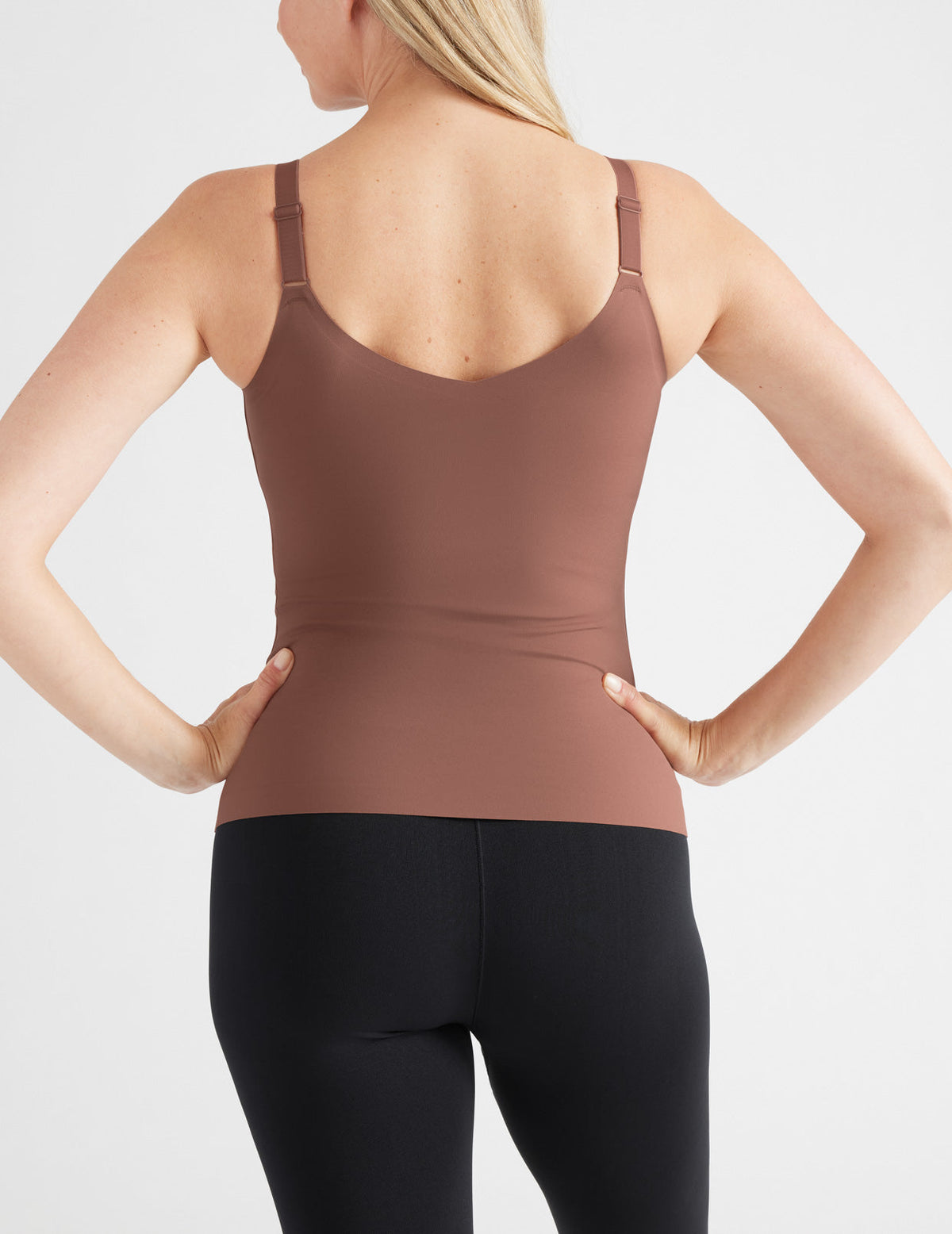 Back view of model wearing the LuxeLift V-Neck Tank, highlighting the neckline, strap design, and silhouette – Sola – view 11 of 20