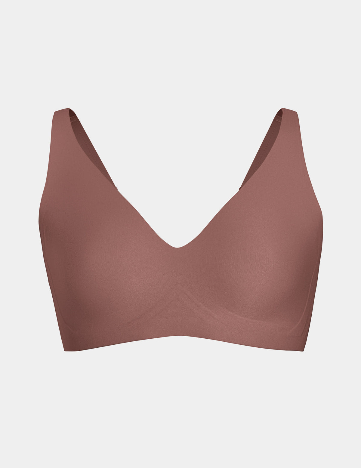 Wireless bra with a V-neckline, adjustable straps, and smooth molded cups, shown front-facing against a light gray background – Sola – view 12 of 50