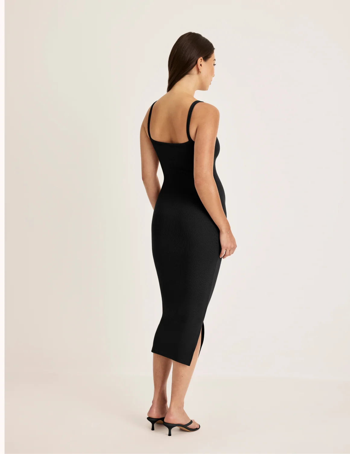 Back view of model wearing the SculptRib™ Cotton Cami Dress highlighting the neckline, fabric and hugging fit – Black – view 8 of 18