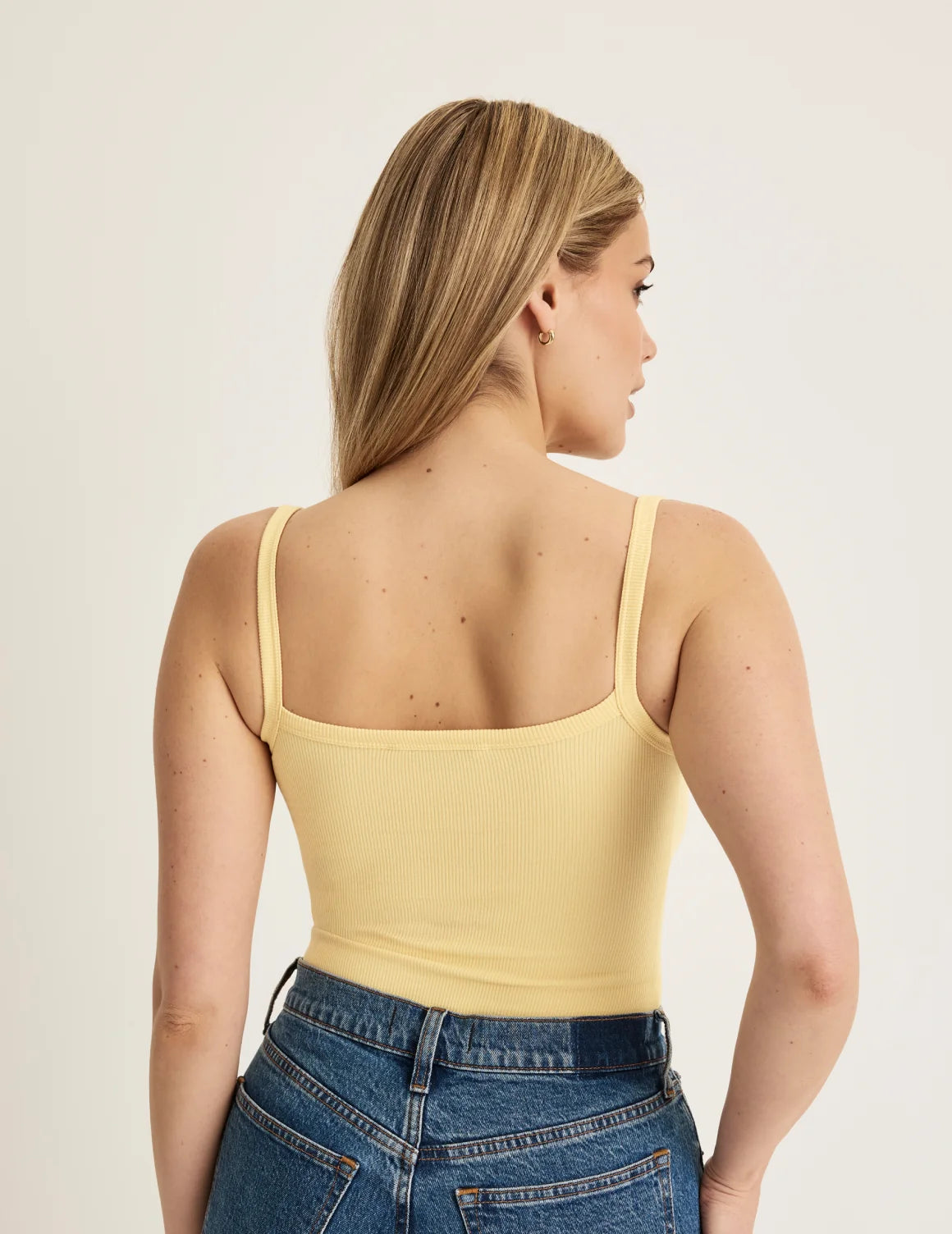 Back view of model wearing the SculptRib™ Cotton Cami highlighting the neckline, fabric and hugging fit – Buttercup – view 12 of 22